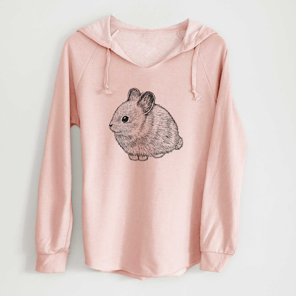 Blush pink women's Cali Wave hooded sweatshirt laid flat, printed with a detailed black ink illustration of a round, fluffy pygmy rabbit.