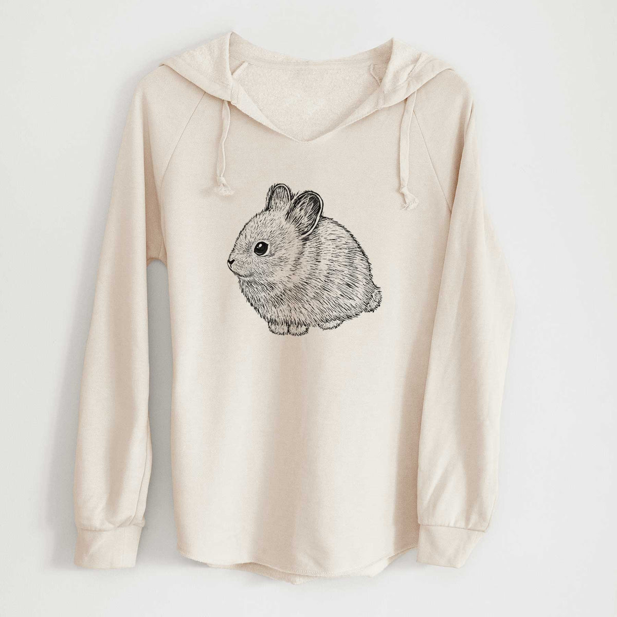 Bone cream women's Cali Wave hooded sweatshirt laid flat, printed with a detailed black ink illustration of a round, fluffy pygmy rabbit.