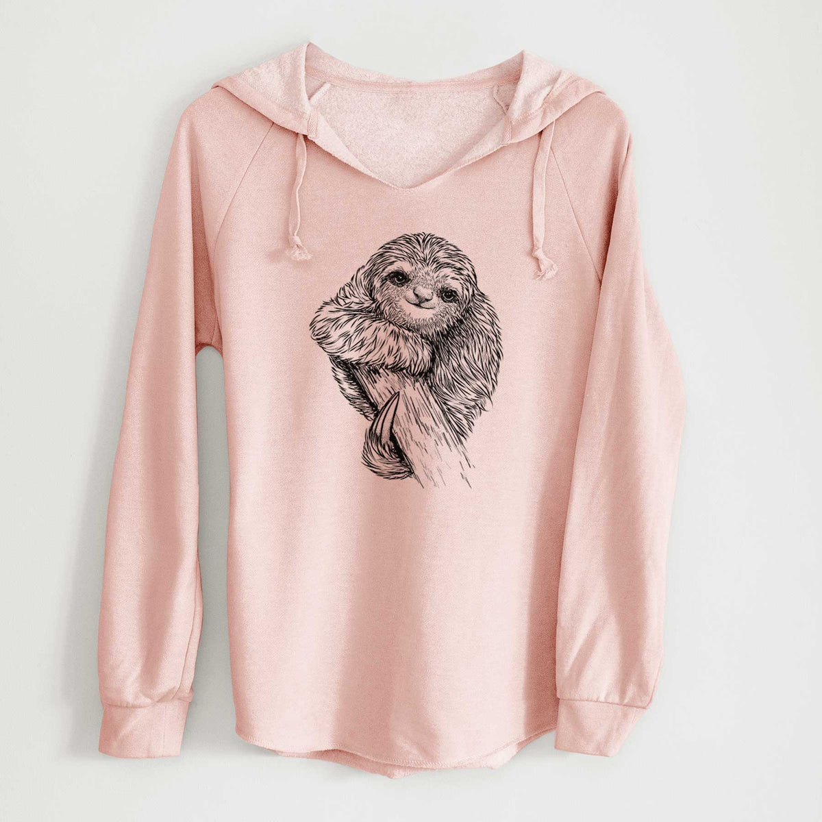 Blush pink women's Cali Wave hooded sweatshirt laid flat, printed with a detailed black ink illustration of a smiling pygmy three-toed sloth hanging from a branch.