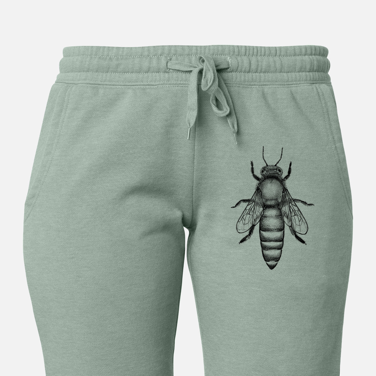 Front of sage green Cali Wave sweatpants, printed with a detailed black ink illustration of a queen honey bee, seen from above on the leg.