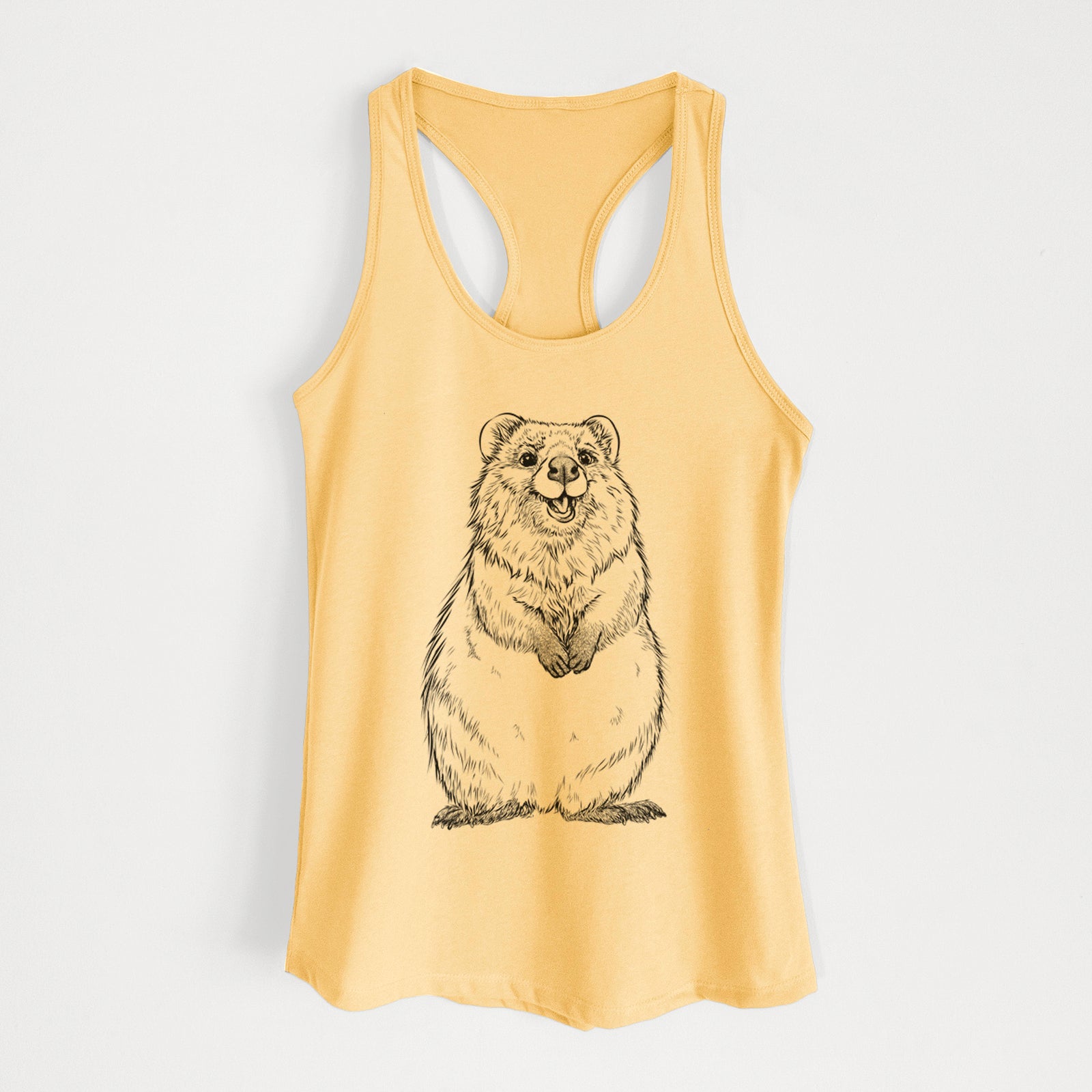 Banana cream women's racerback tank top laid flat, printed with a black ink illustration of a smiling quokka sitting upright.