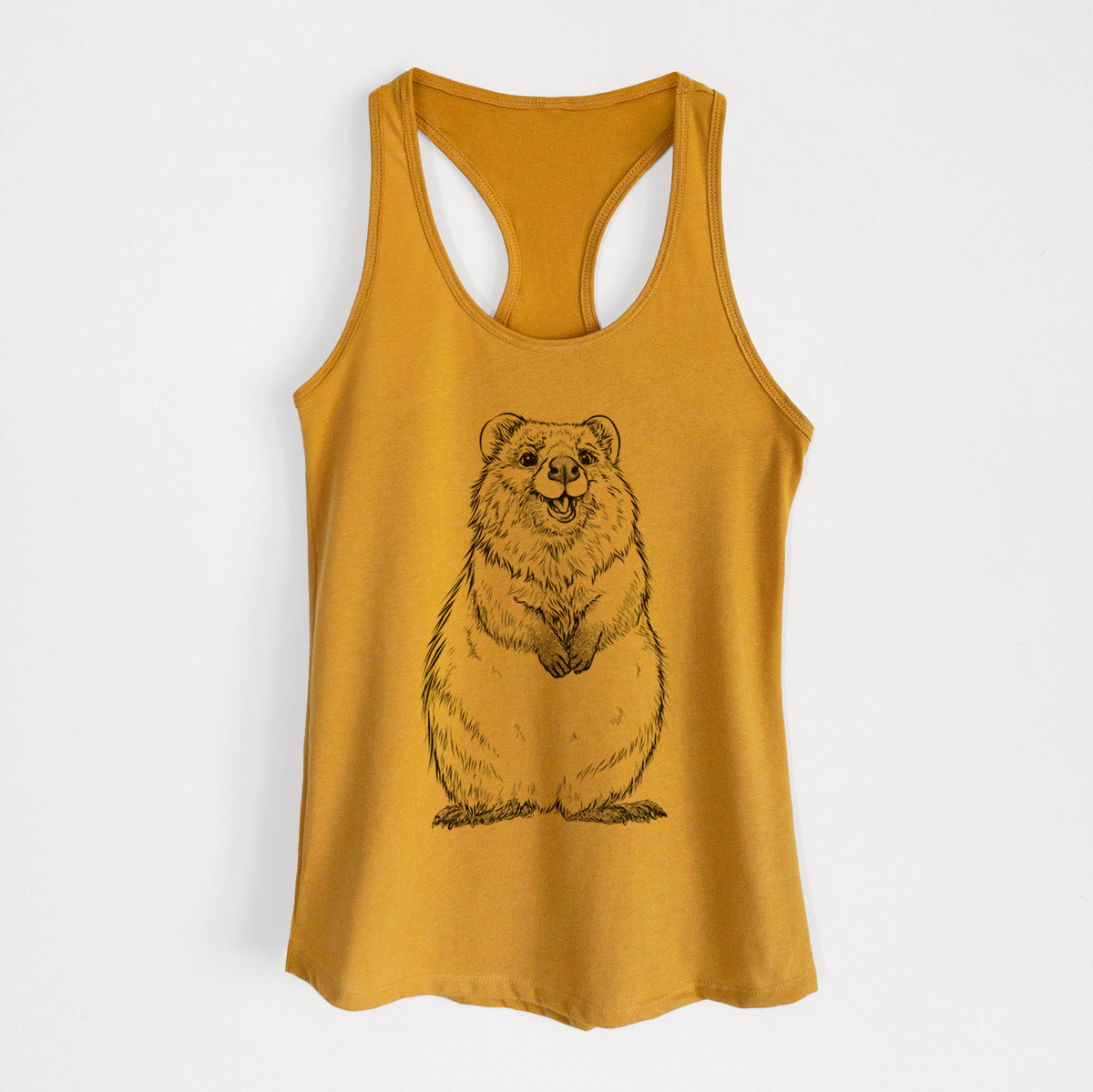 Gold women's racerback tank top laid flat, printed with a black ink illustration of a smiling quokka sitting upright.