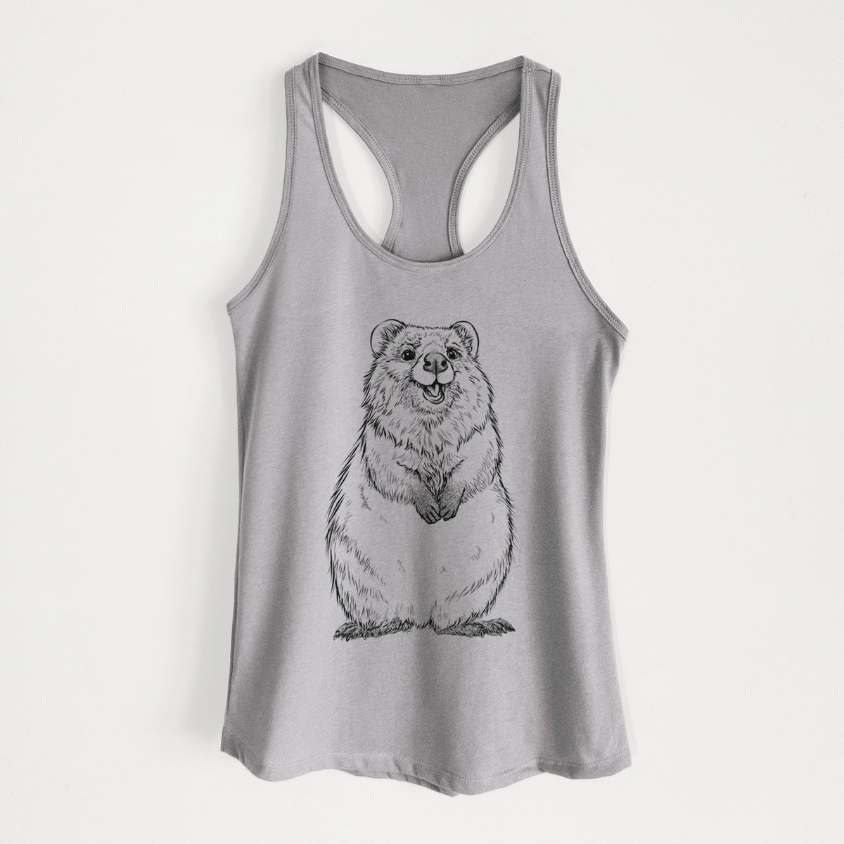 Heather grey women's racerback tank top laid flat, printed with a black ink illustration of a smiling quokka sitting upright.