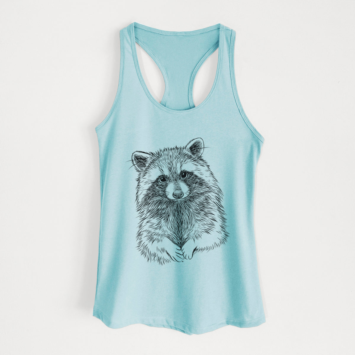 Cancun blue women's racerback tank top laid flat, printed with a detailed black ink portrait of a raccoon with its front paws resting in front of it.
