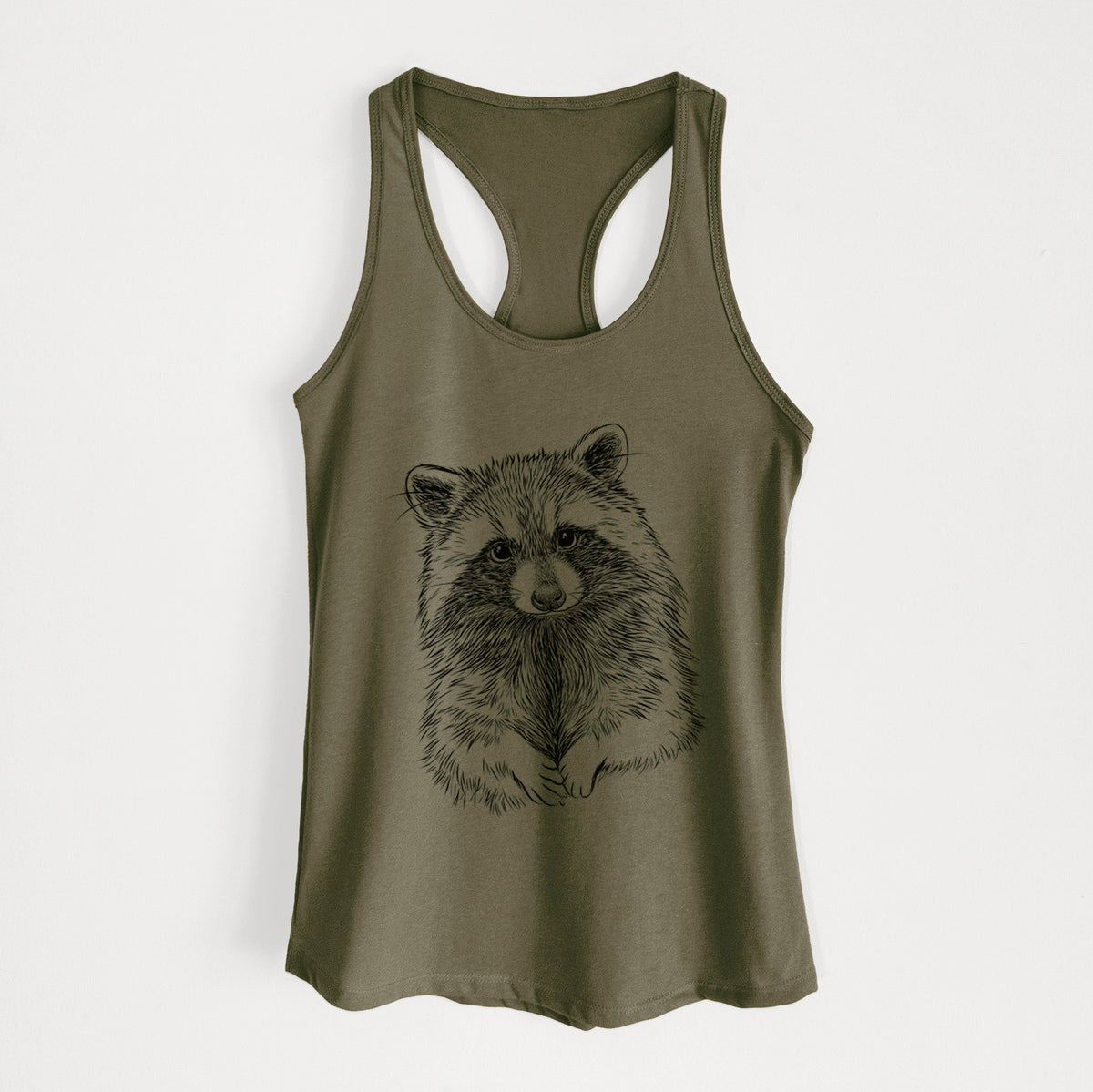 Military green women's racerback tank top laid flat, printed with a detailed black ink portrait of a raccoon with its front paws resting in front of it.