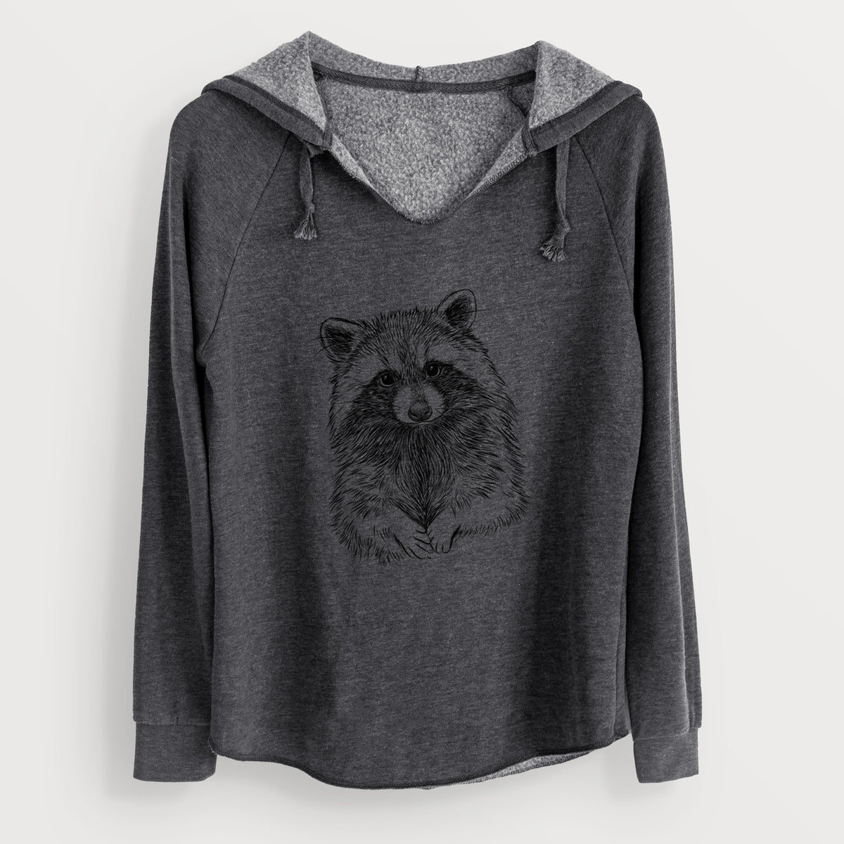 Charcoal grey women's Cali Wave hooded sweatshirt laid flat, printed with a detailed black ink portrait of a raccoon with its front paws resting in front of it.