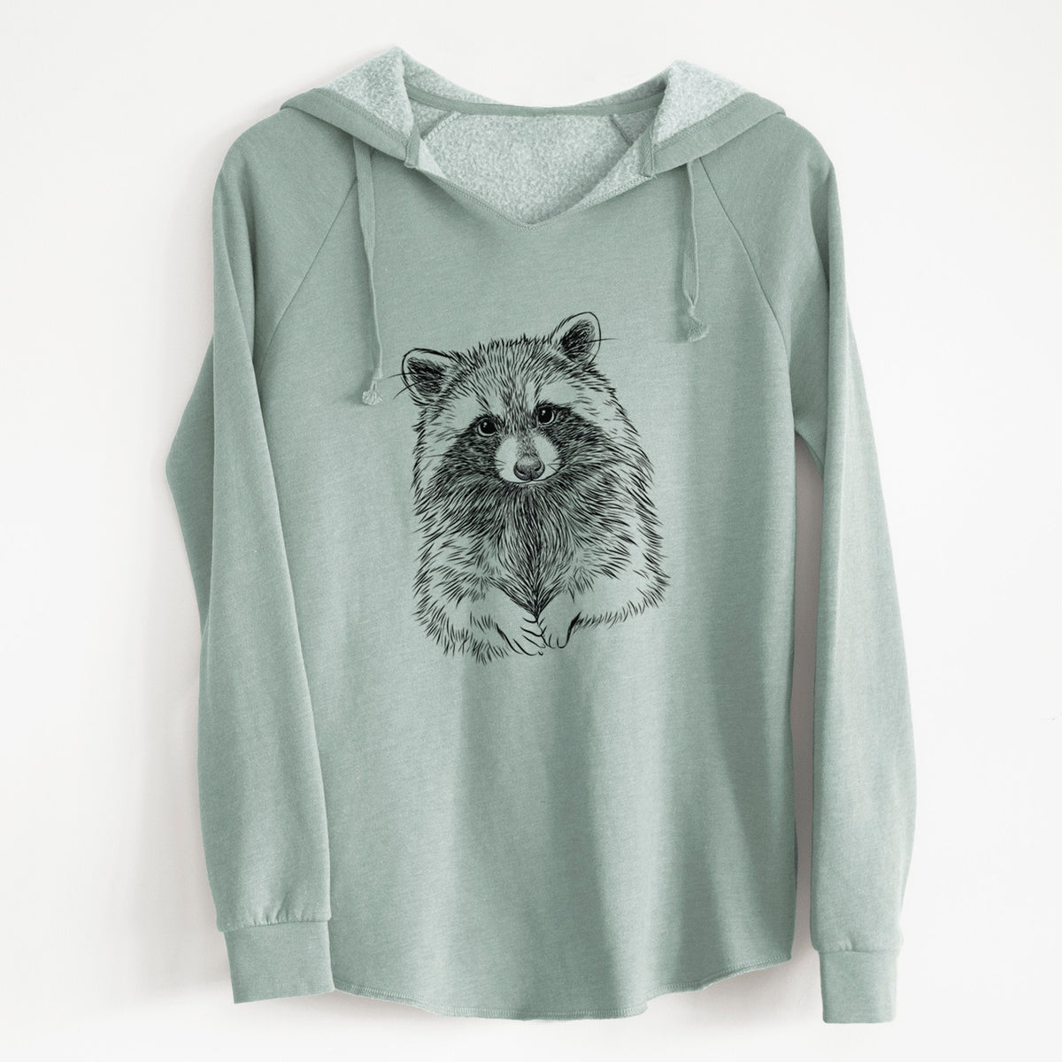 Sage green women's Cali Wave hooded sweatshirt laid flat, printed with a detailed black ink portrait of a raccoon with its front paws resting in front of it.