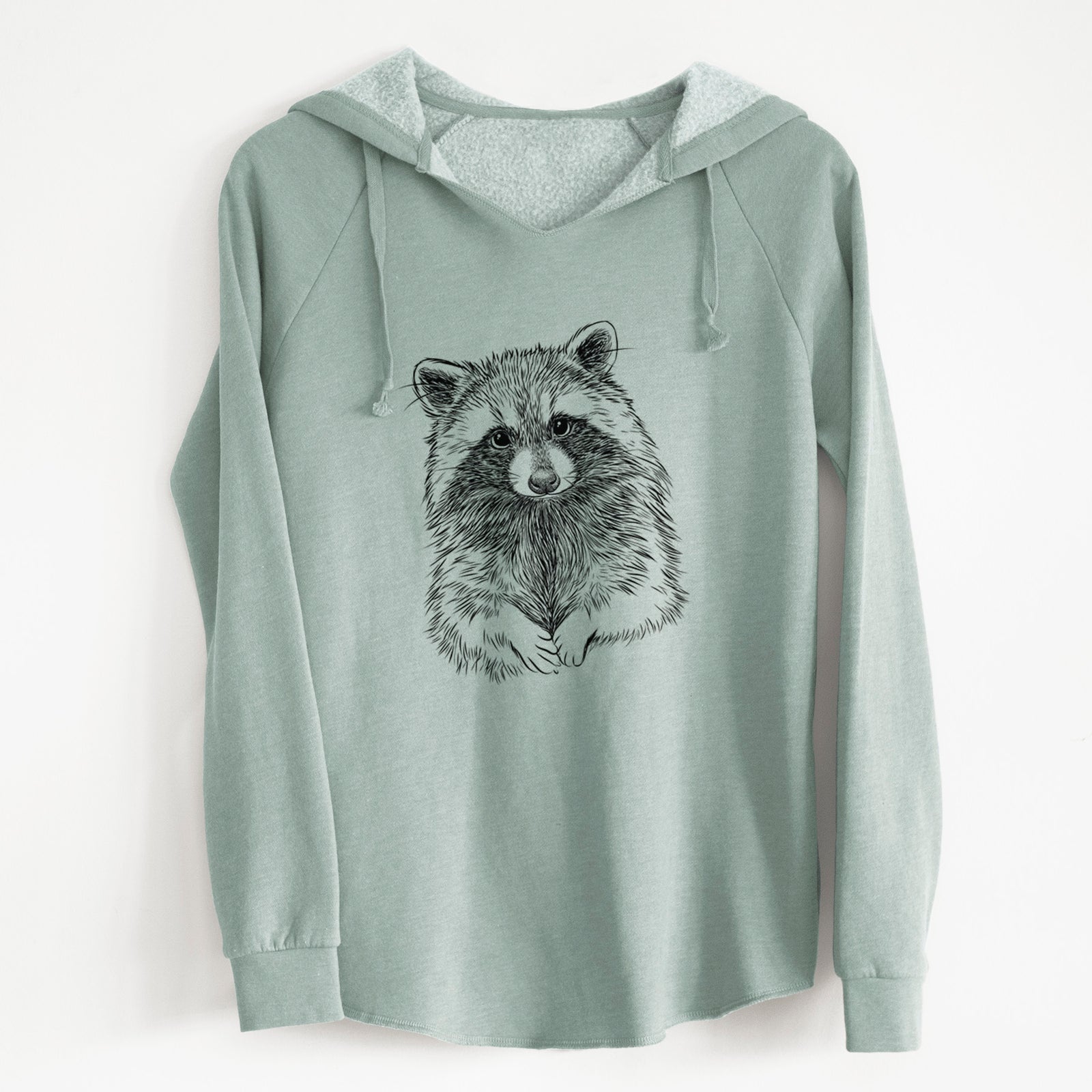 Sage green women's Cali Wave hooded sweatshirt laid flat, printed with a detailed black ink portrait of a raccoon with its front paws resting in front of it.
