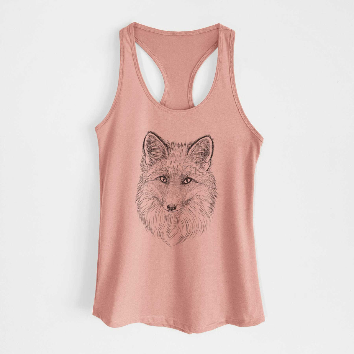Desert pink women's racerback tank top laid flat, printed with a detailed black ink sketch of a red fox's face looking straight ahead, its fur drawn in fine pencil-like strokes.