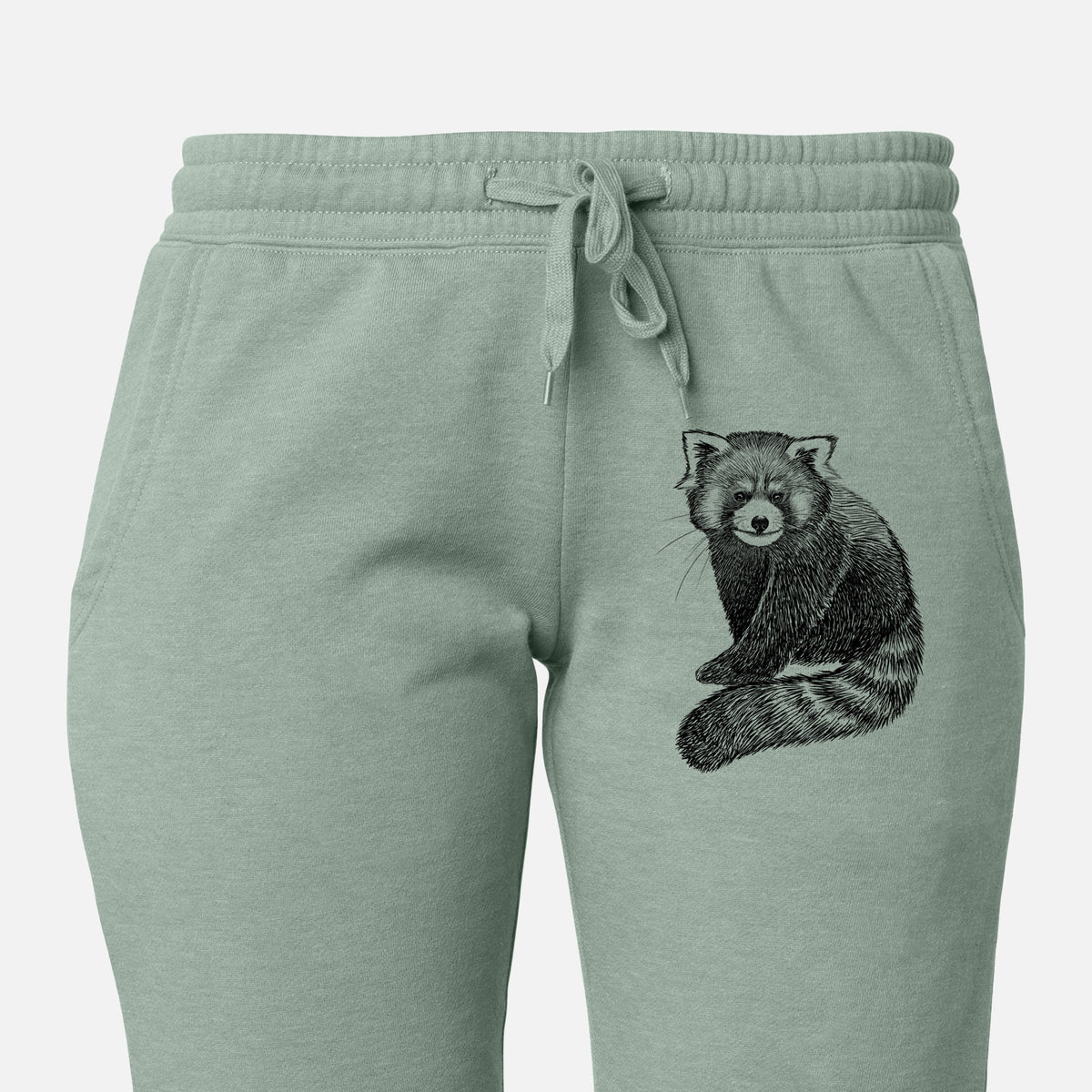 Front of sage green Cali Wave sweatpants, printed with a detailed black ink illustration of a red panda sitting with its striped tail wrapped around on the leg.
