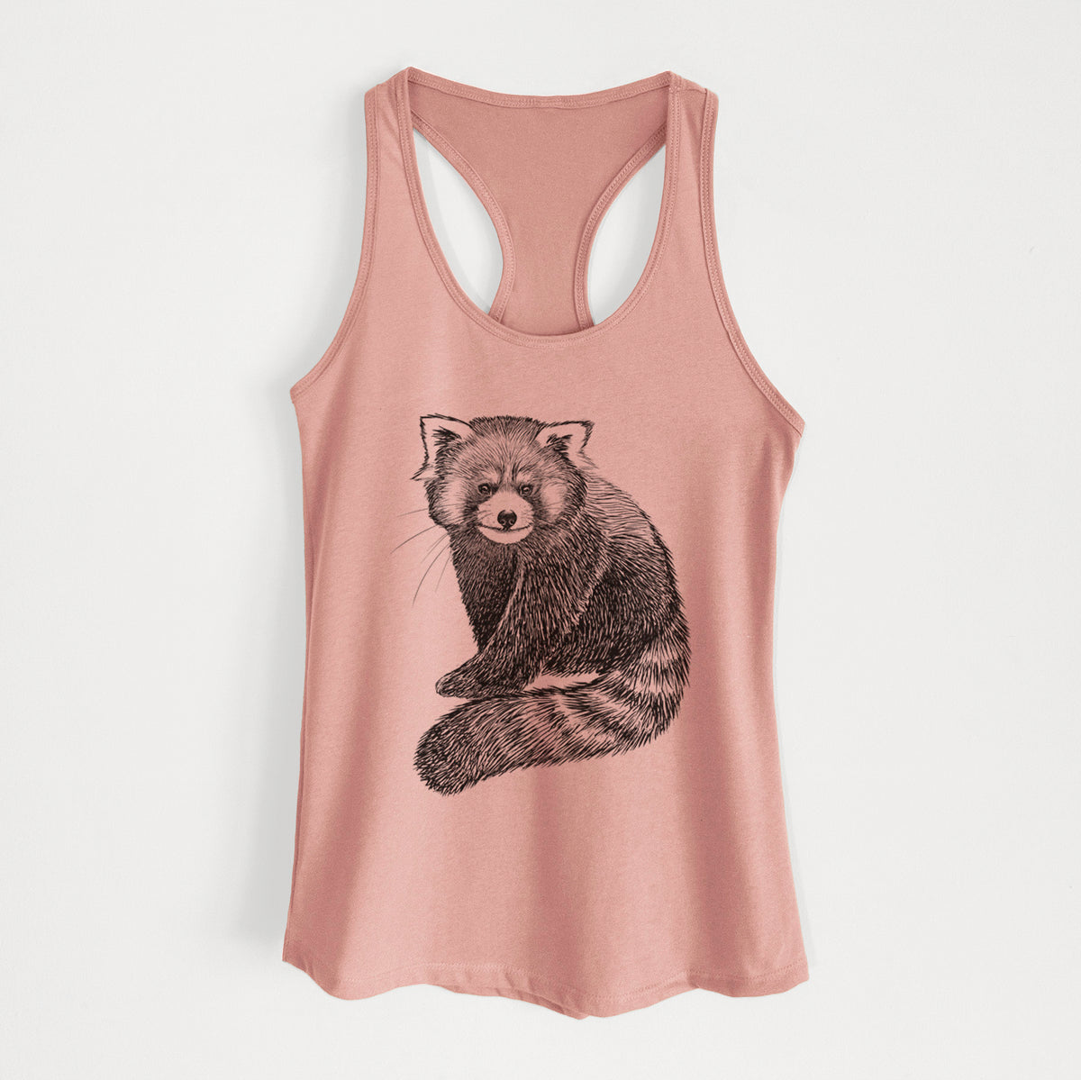 Desert pink women's racerback tank top laid flat, printed with a detailed black ink illustration of a red panda sitting with its striped tail wrapped around.