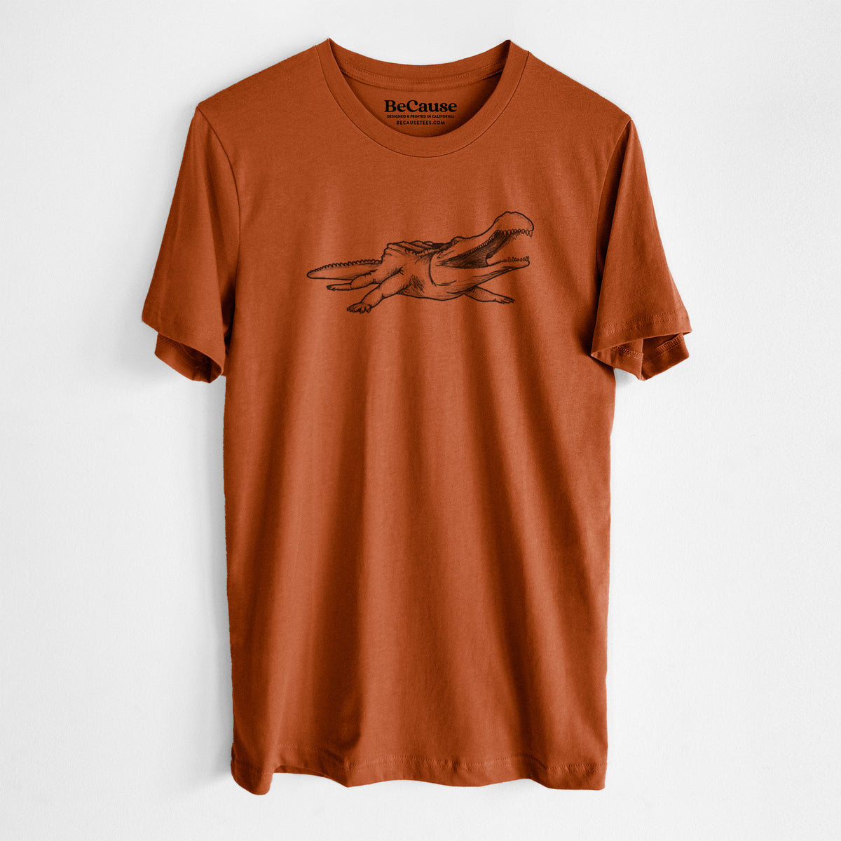 Autumn lightweight cotton t-shirt laid flat, printed with a black ink illustration of a Sarcosuchus, a giant prehistoric crocodile.