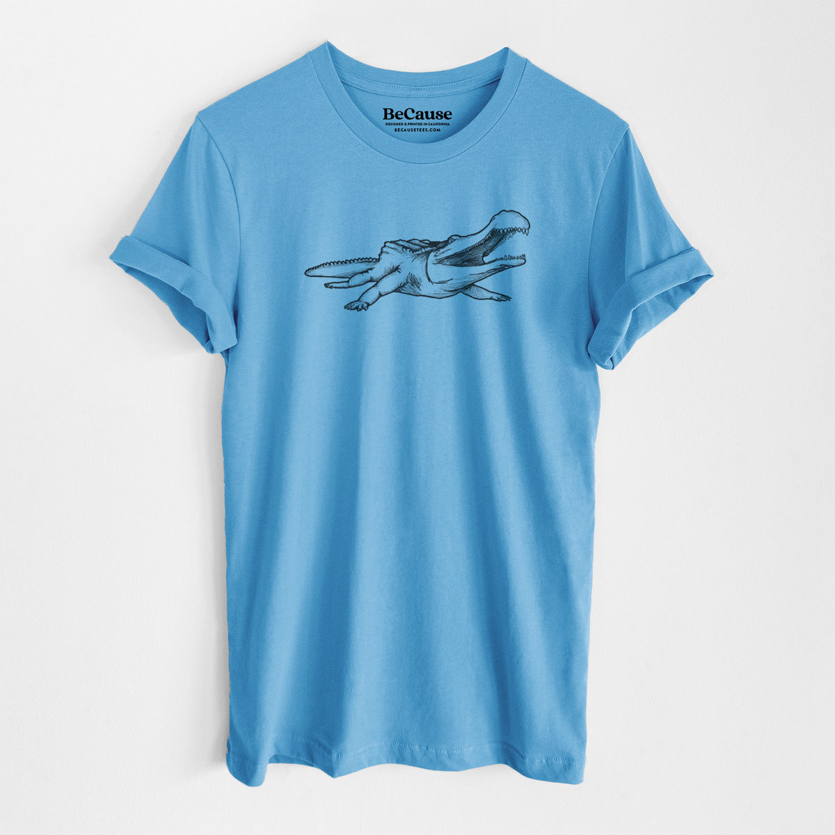 Ocean blue lightweight cotton t-shirt laid flat, printed with a black ink illustration of a Sarcosuchus, a giant prehistoric crocodile.