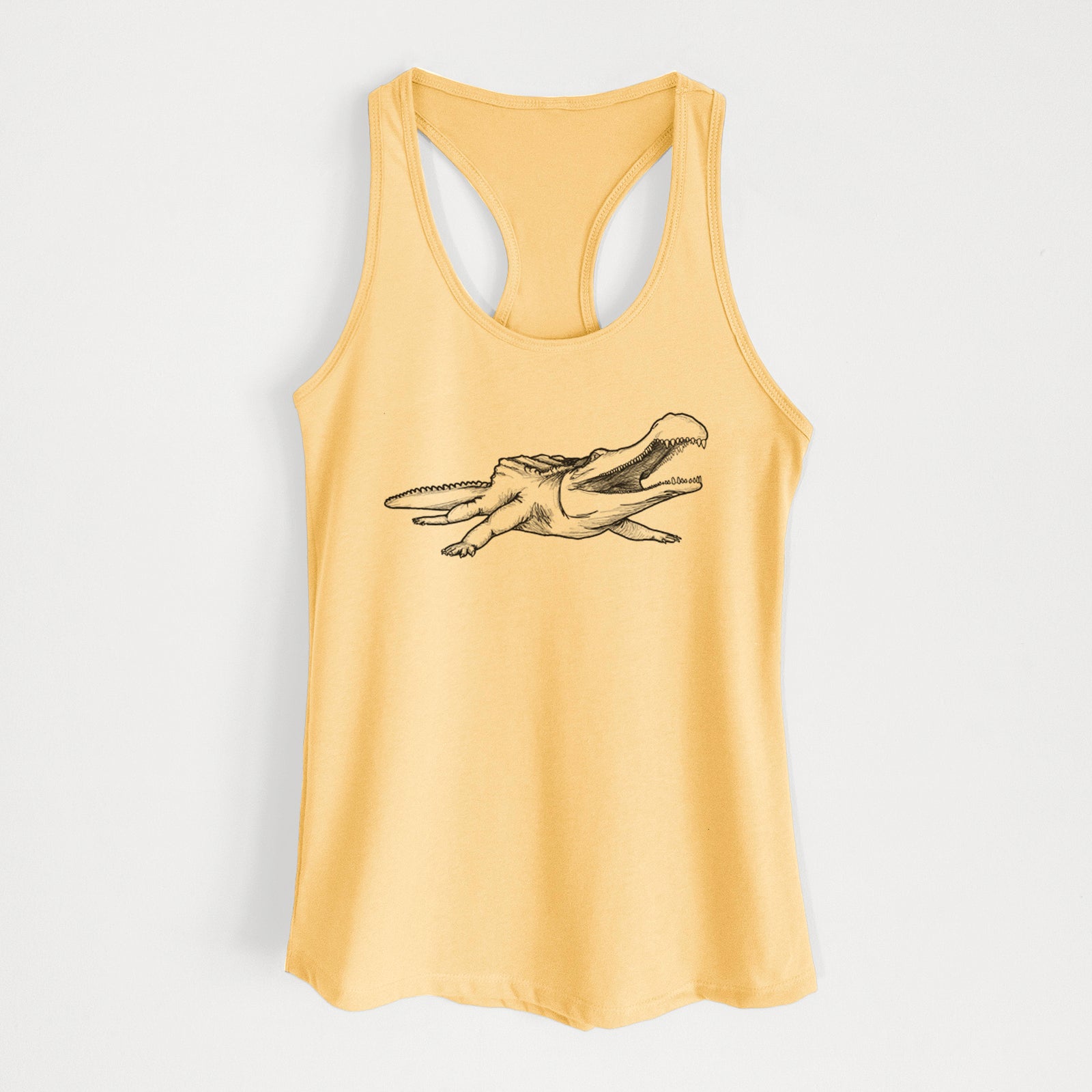 Banana cream women's racerback tank top laid flat, printed with a black ink illustration of a Sarcosuchus, a giant prehistoric crocodile.