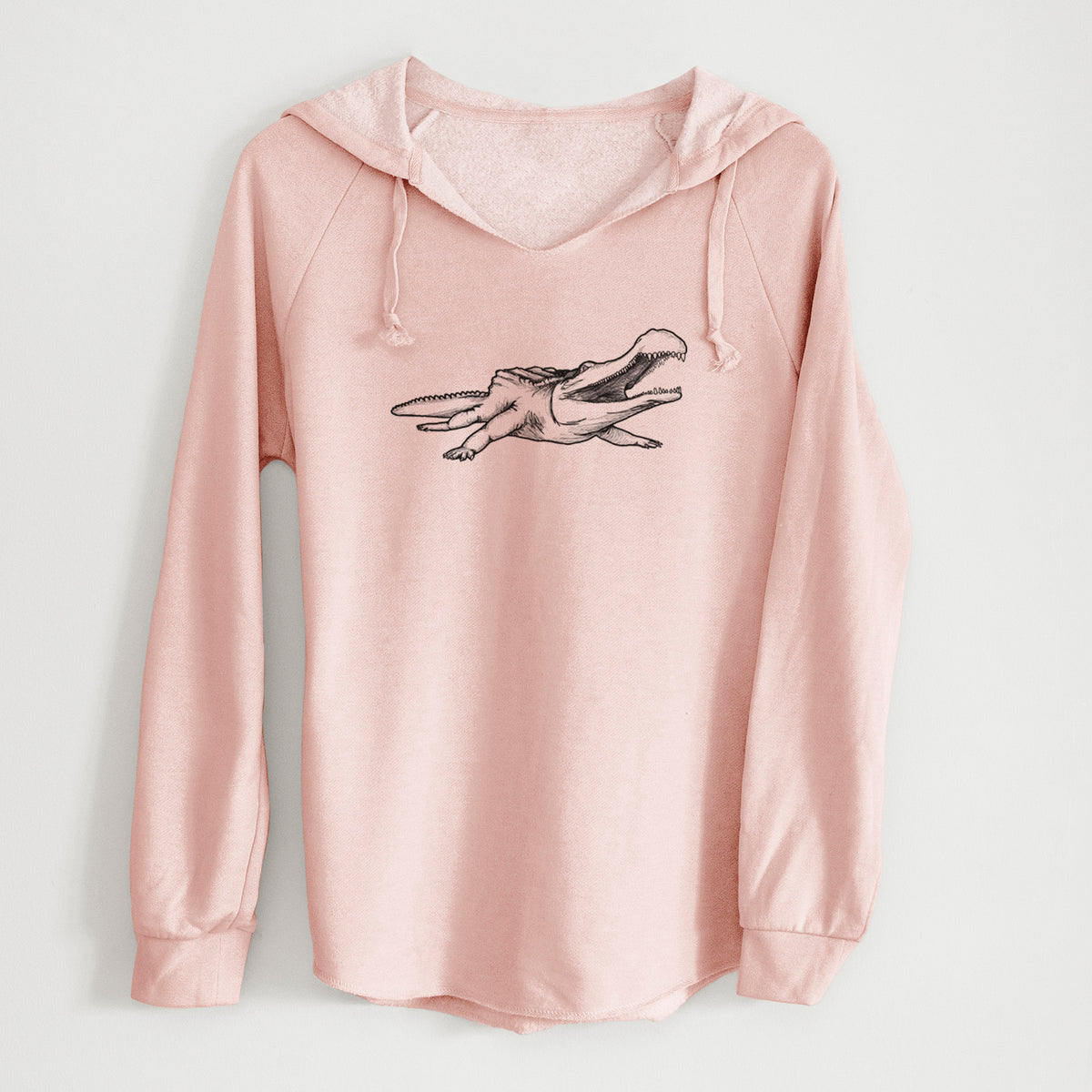 Blush pink women's Cali Wave hooded sweatshirt laid flat, printed with a black ink illustration of a Sarcosuchus, a giant prehistoric crocodile.
