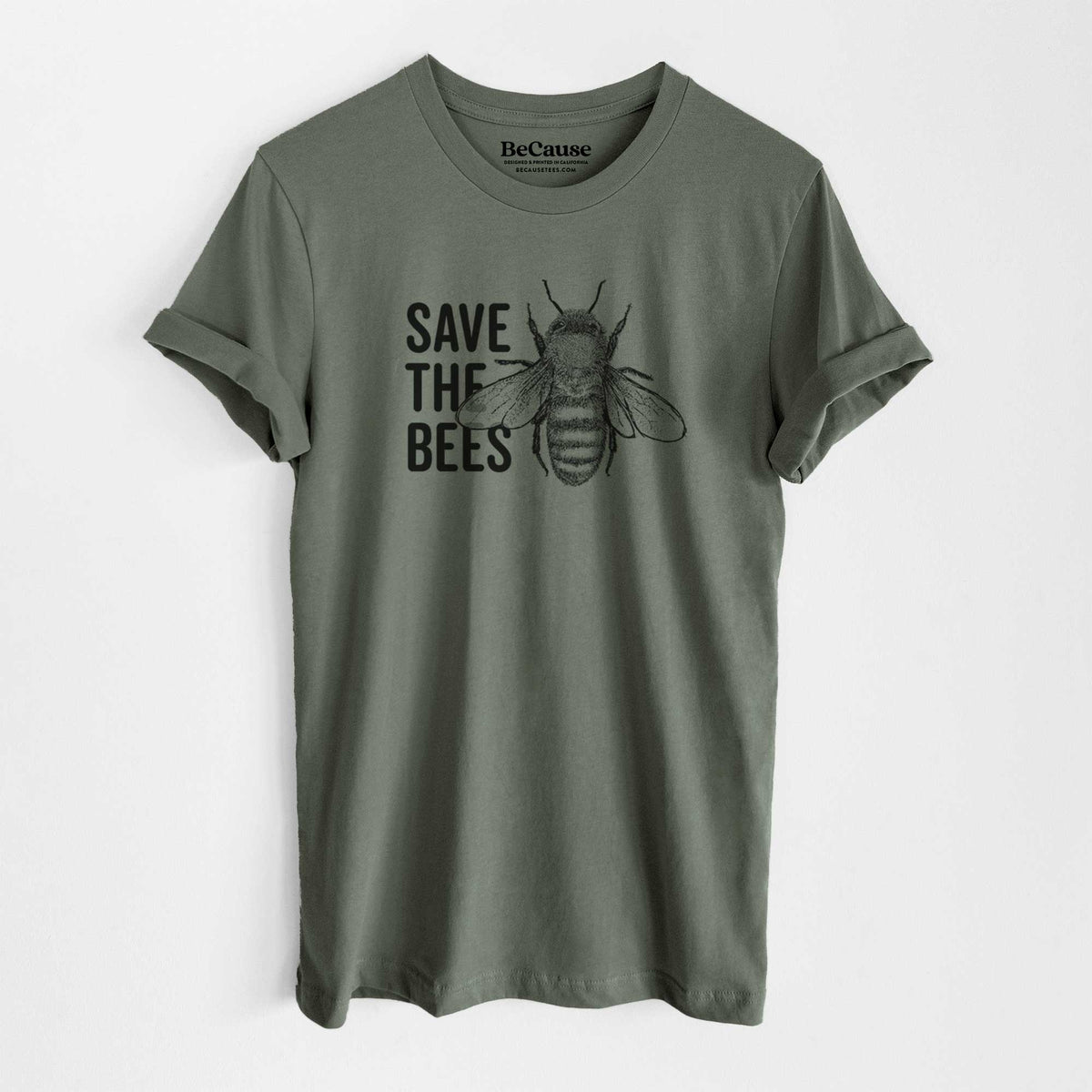 Military green lightweight cotton t-shirt laid flat, printed with bold black words reading Save the Bees beside a detailed honey bee illustration.
