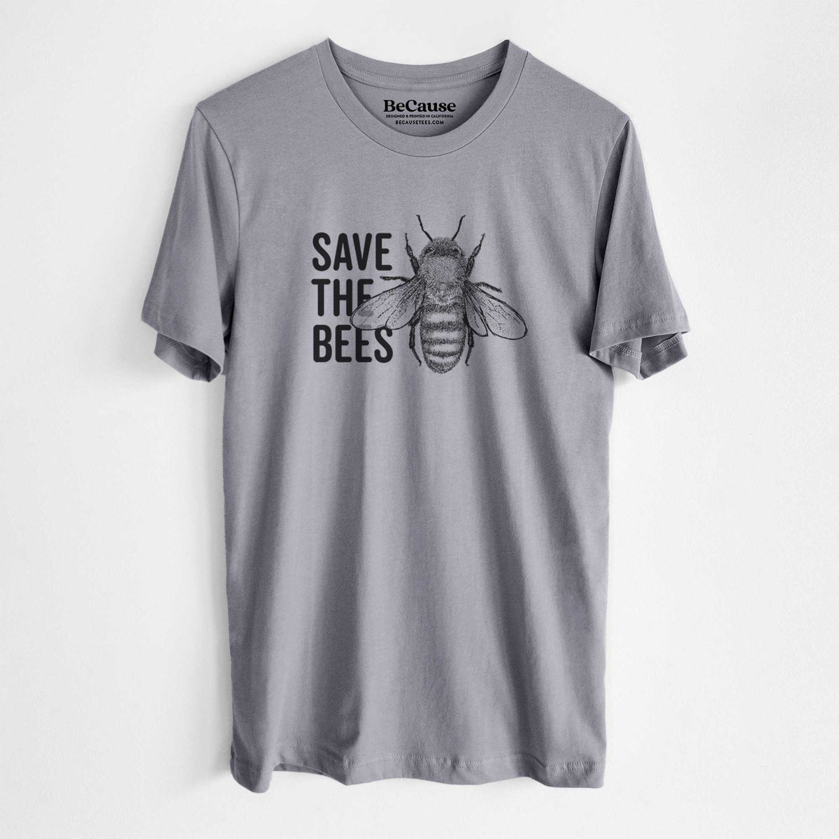 Storm grey lightweight cotton t-shirt laid flat, printed with bold black words reading Save the Bees beside a detailed honey bee illustration.