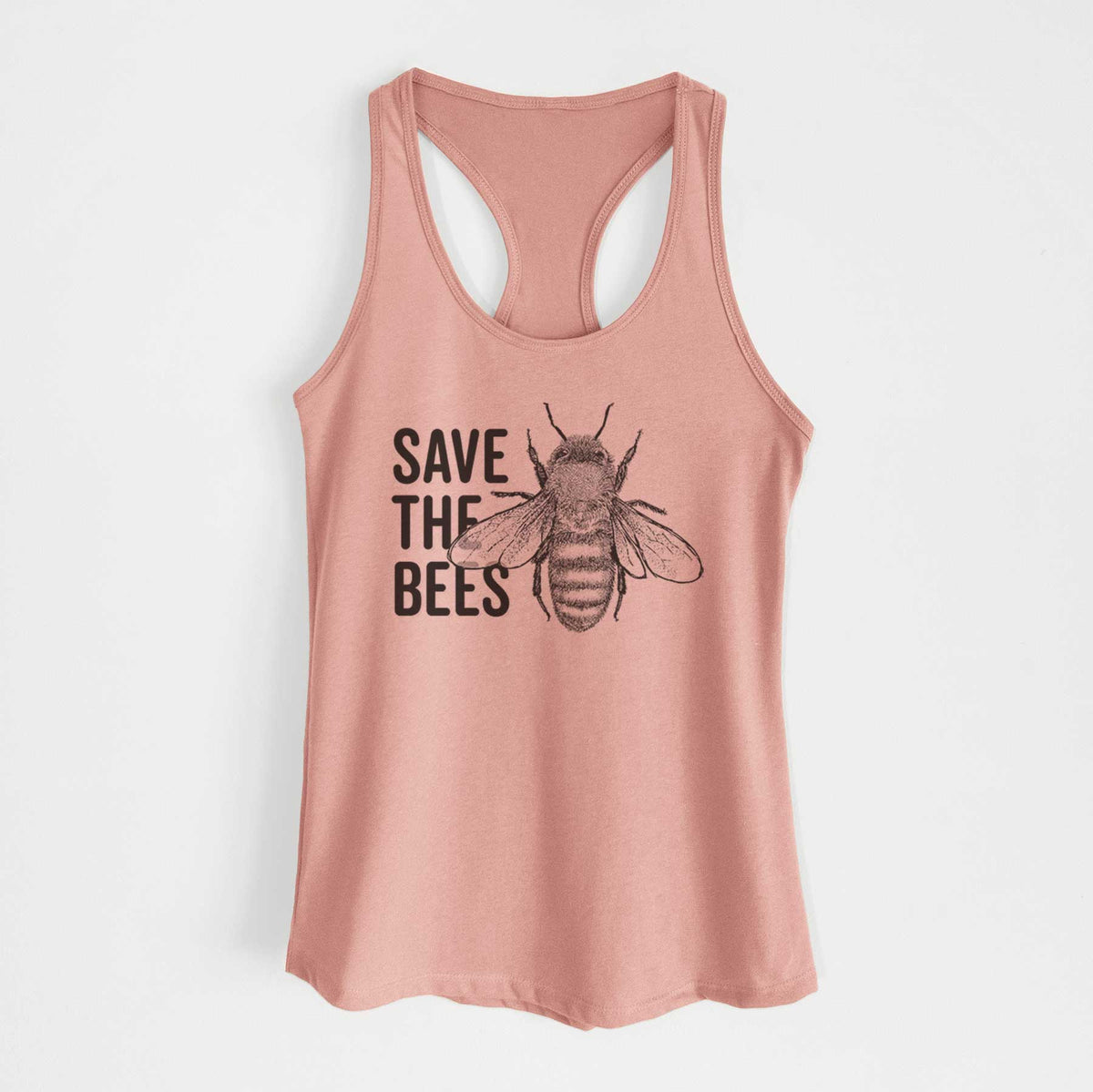 Desert pink women's racerback tank top laid flat, printed with bold black words reading Save the Bees beside a detailed honey bee illustration.
