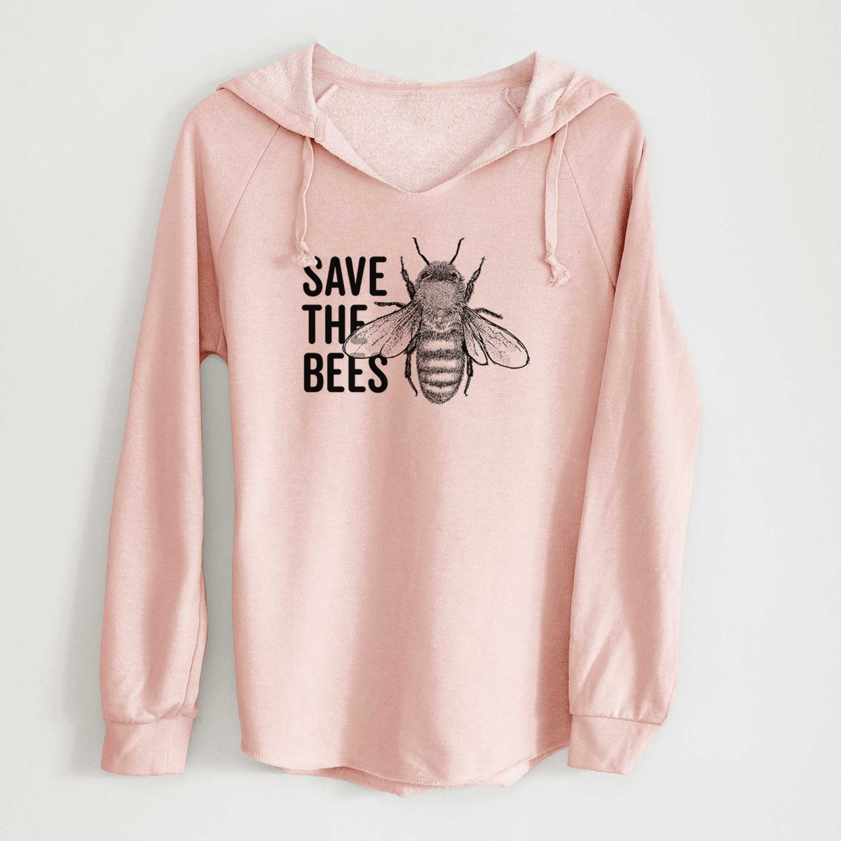 Blush pink women's Cali Wave hooded sweatshirt laid flat, printed with bold black words reading Save the Bees beside a detailed honey bee illustration.