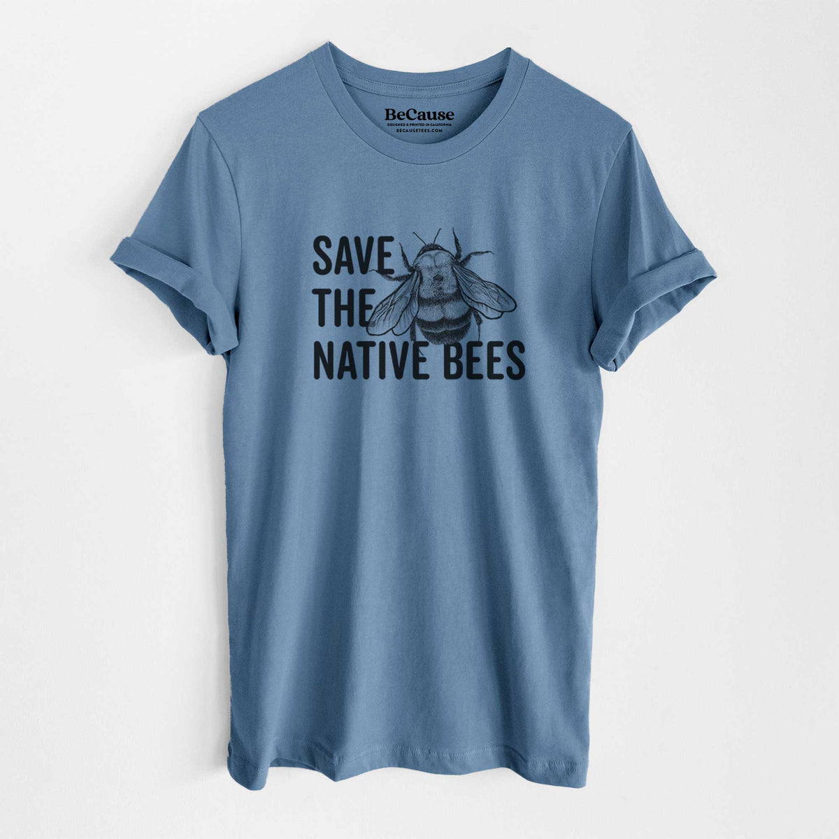 Steel blue lightweight cotton t-shirt laid flat, printed with bold black words reading Save the Native Bees beside a detailed bee illustration.