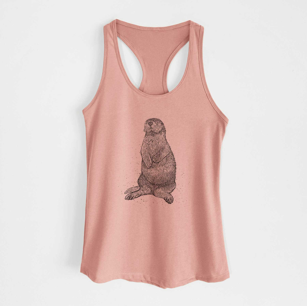 Desert pink women's racerback tank top laid flat, printed with a detailed black ink illustration of a sea otter sitting upright.