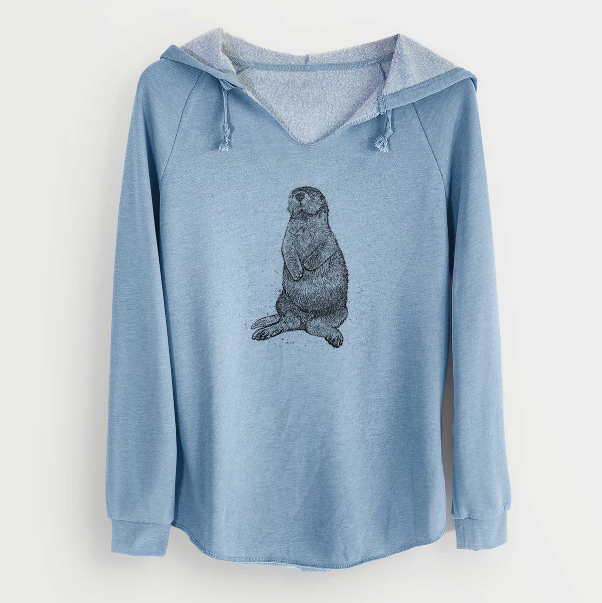 Misty blue women's Cali Wave hooded sweatshirt laid flat, printed with a detailed black ink illustration of a sea otter sitting upright.
