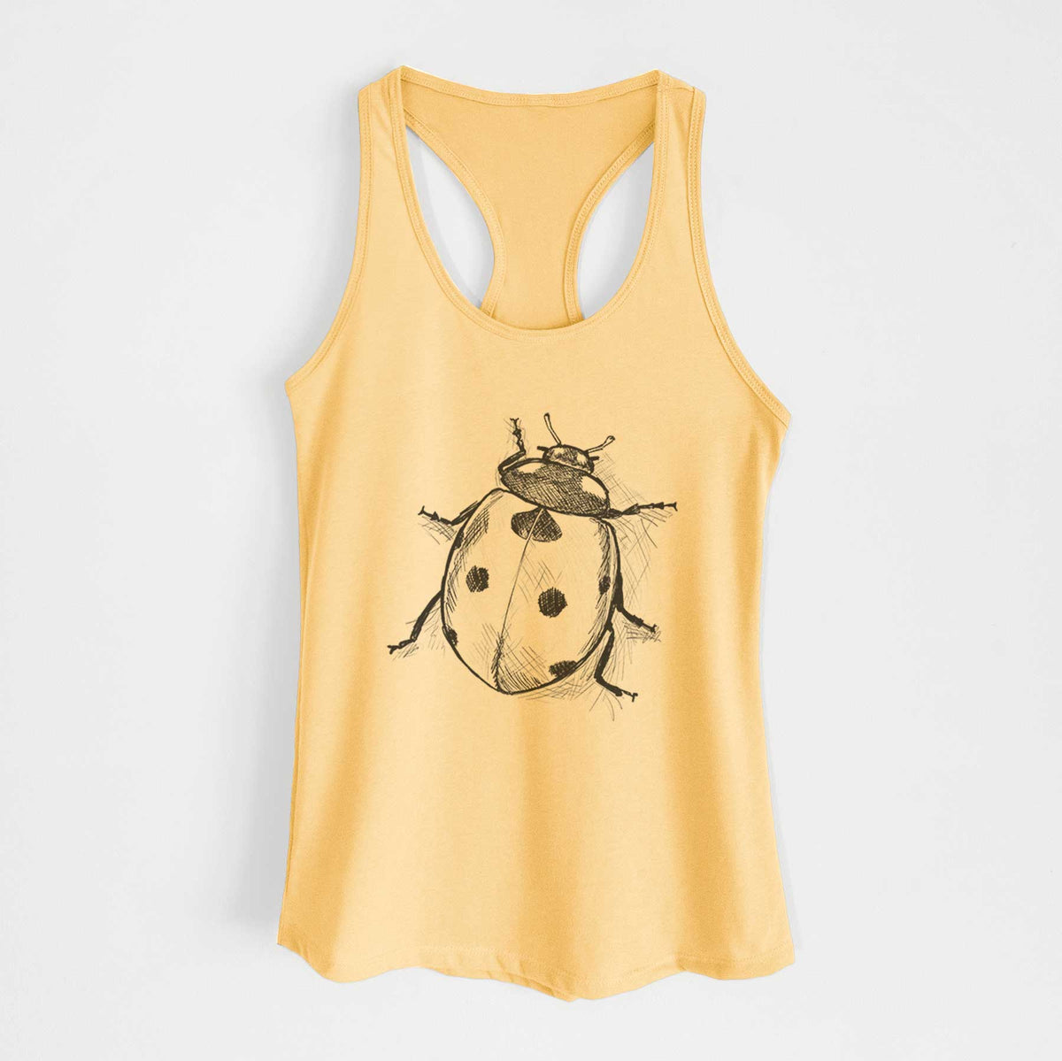 Banana cream women's racerback tank top laid flat, printed with a detailed black ink illustration of a seven-spot ladybird beetle.