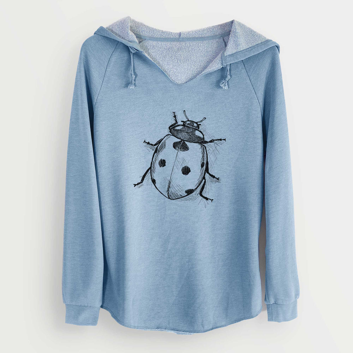 Misty blue women's Cali Wave hooded sweatshirt laid flat, printed with a detailed black ink illustration of a seven-spot ladybird beetle.
