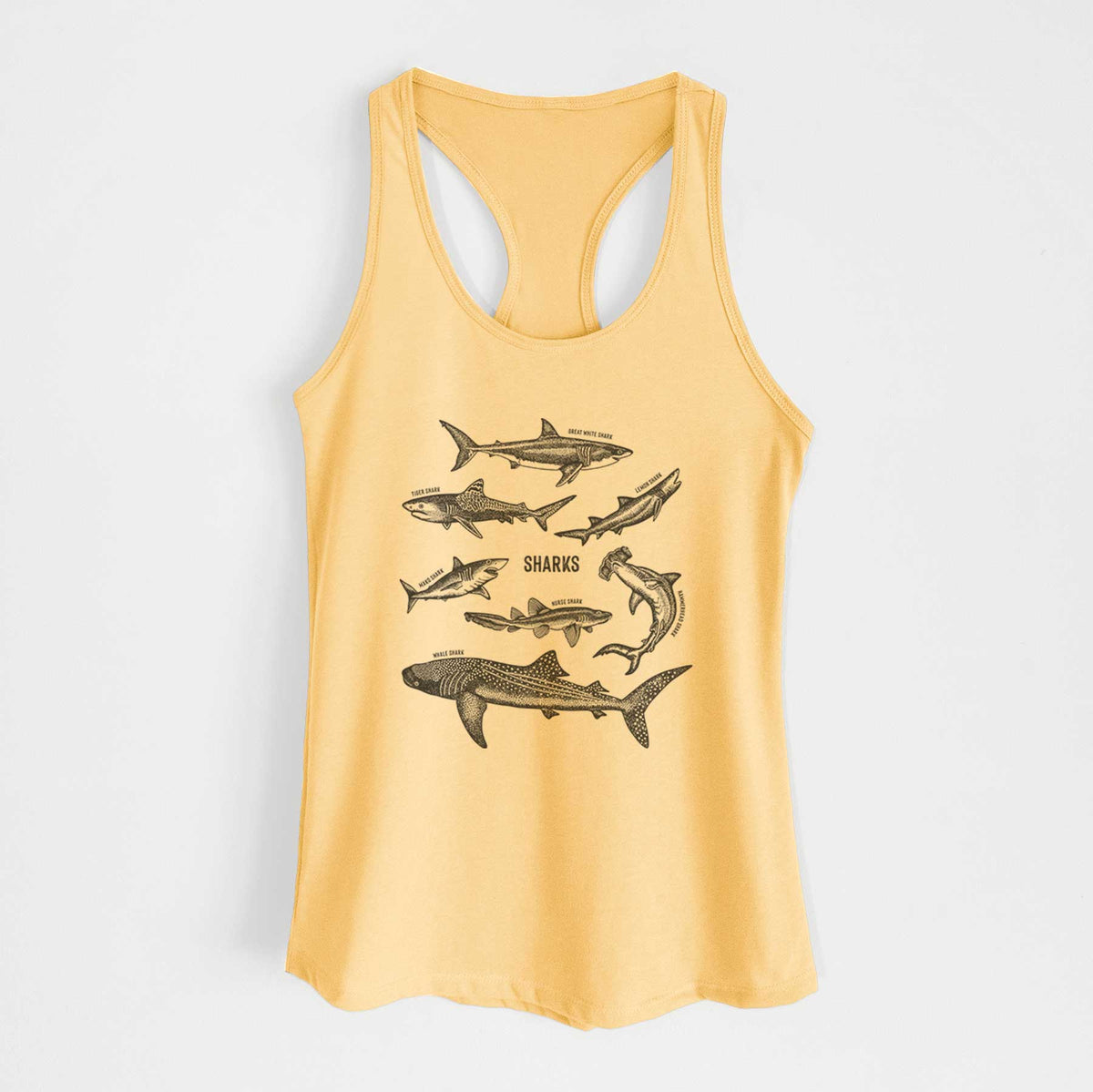 Banana cream women's racerback tank top laid flat, printed with a chart of black ink shark illustrations, including a whale shark, hammerhead and great white.