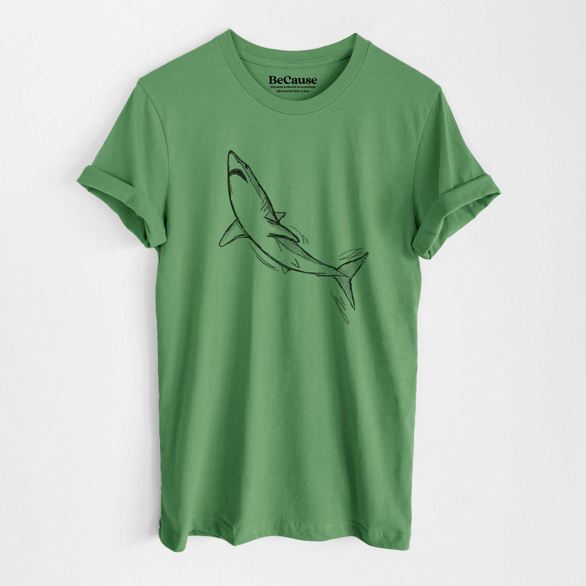 Leaf green lightweight cotton t-shirt laid flat, printed with a black ink illustration of a shortfin mako shark diving.