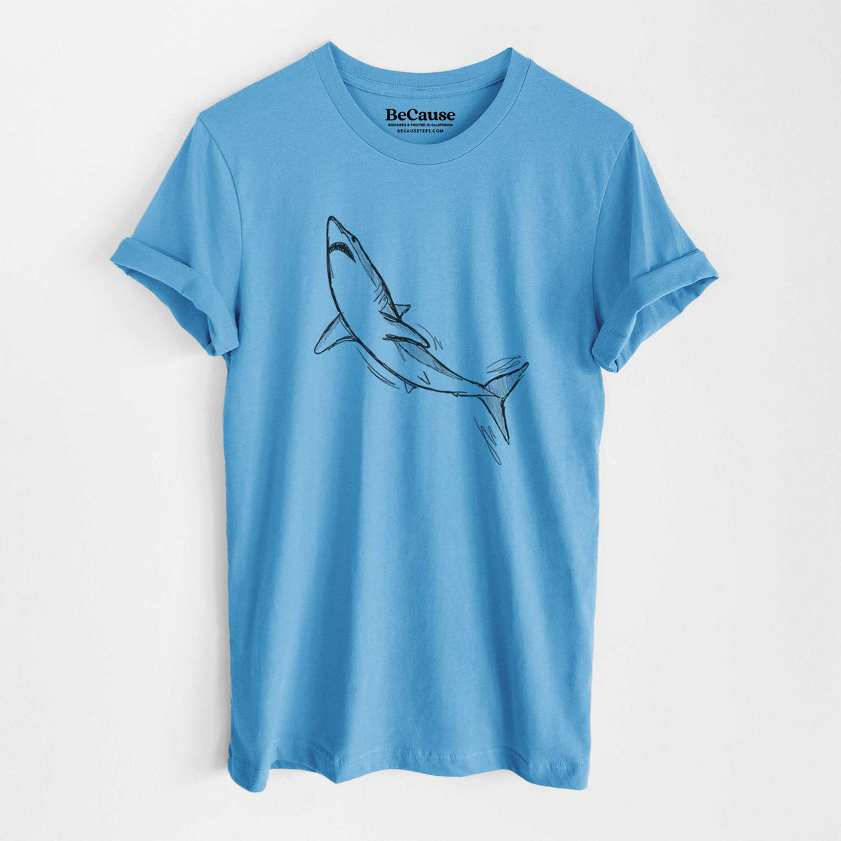 Ocean blue lightweight cotton t-shirt laid flat, printed with a black ink illustration of a shortfin mako shark diving.