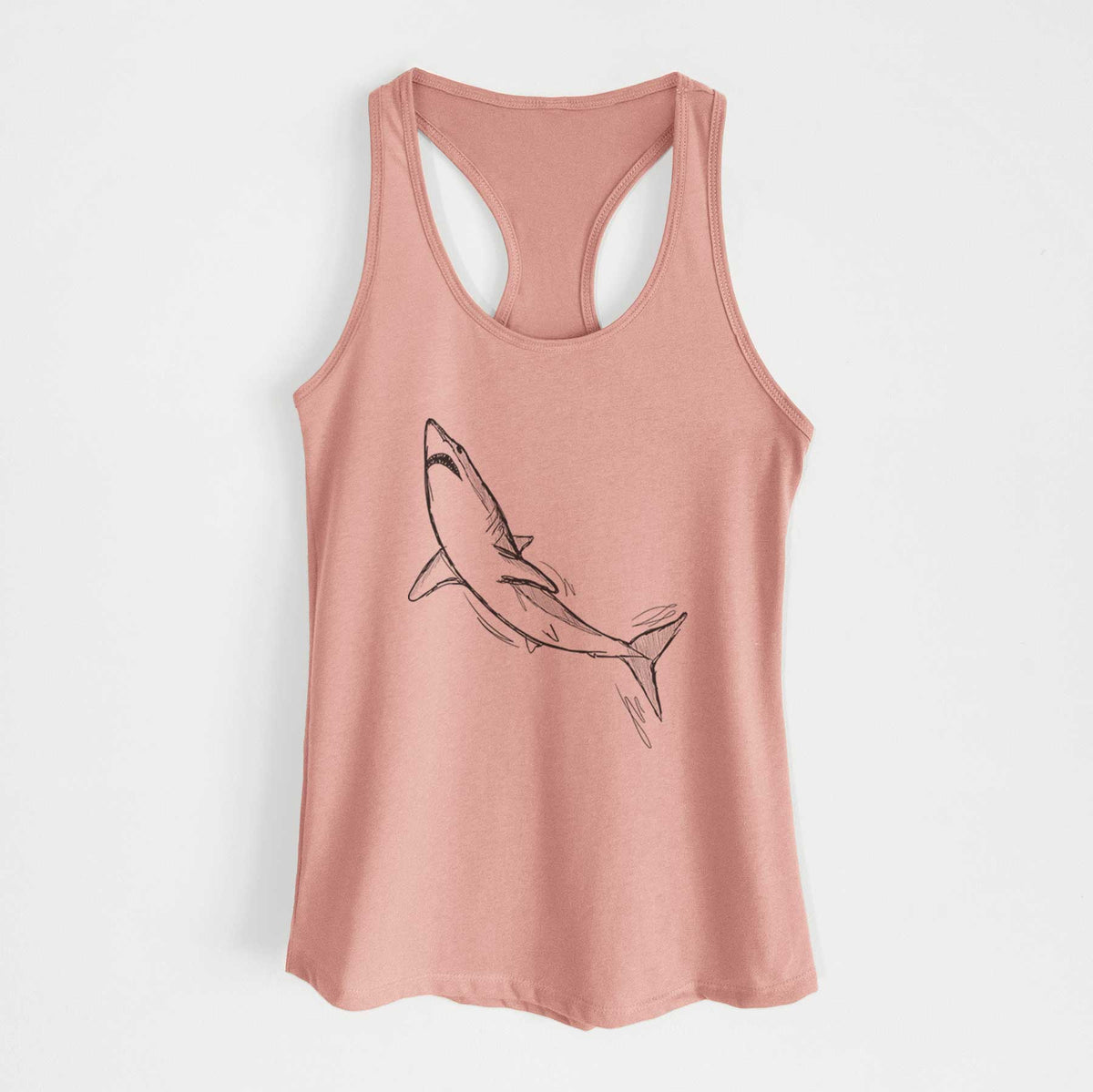 Desert pink women's racerback tank top laid flat, printed with a black ink illustration of a shortfin mako shark diving.