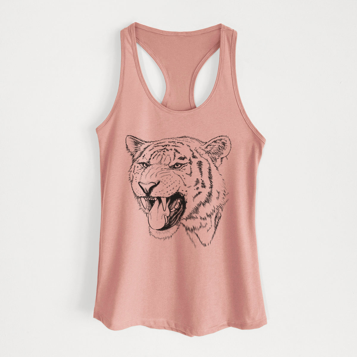 Desert pink women's racerback tank top laid flat, printed with a detailed black ink portrait of a roaring Siberian tiger.