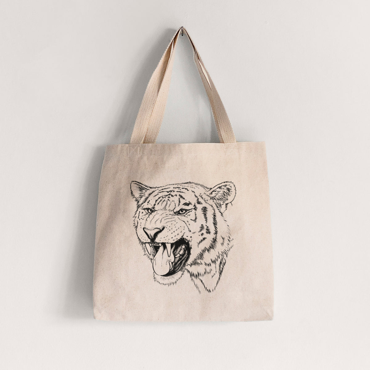 Natural canvas tote bag printed with a detailed black ink portrait of a roaring Siberian tiger.