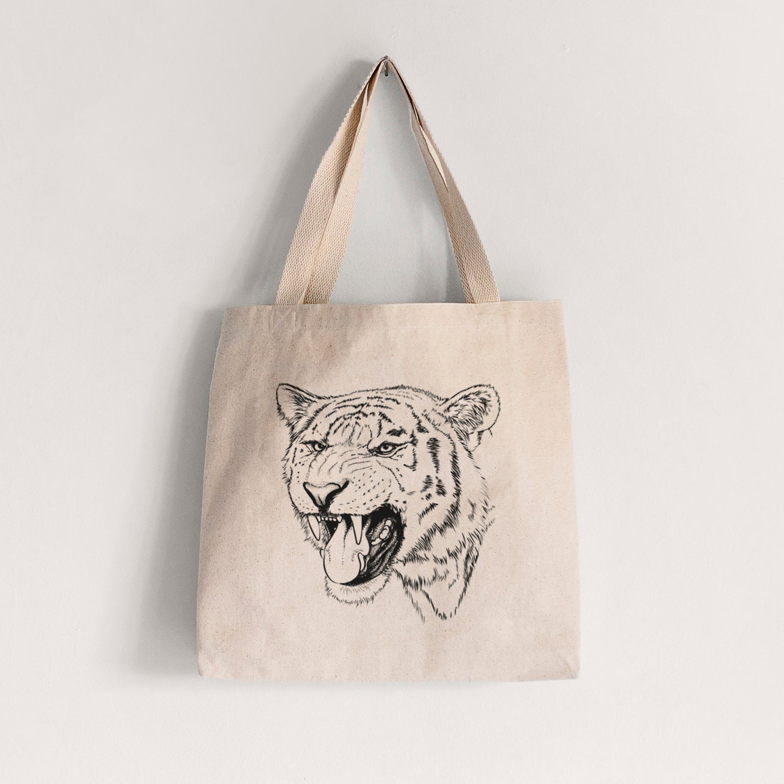 Natural canvas tote bag printed with a detailed black ink portrait of a roaring Siberian tiger.