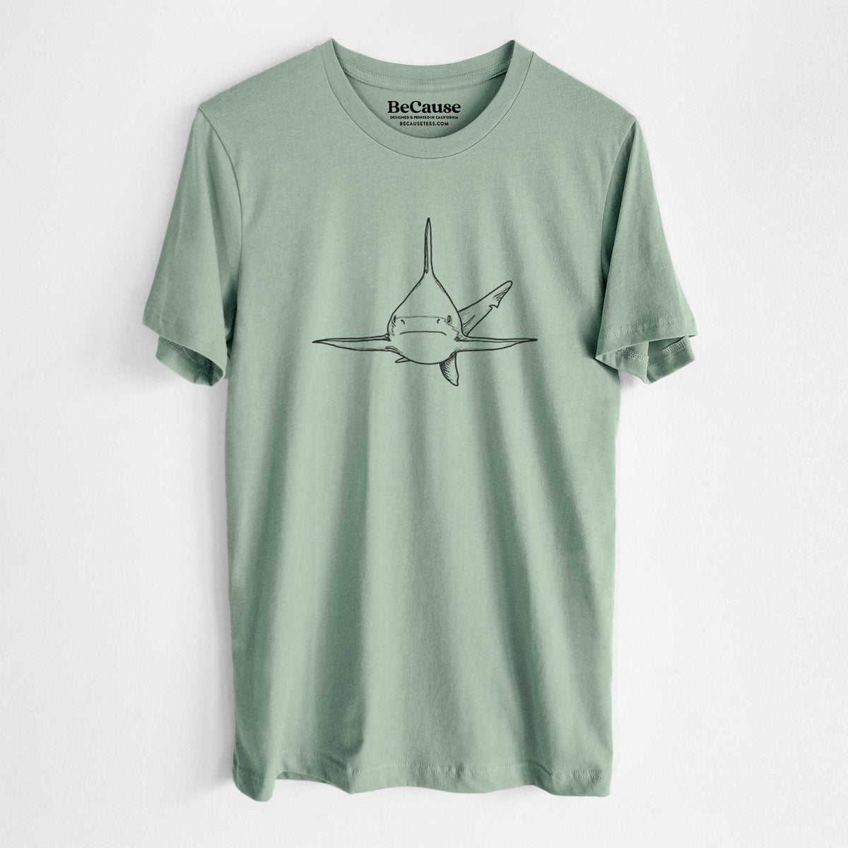 Sage green lightweight cotton t-shirt laid flat, printed with a black ink illustration of a silvertip shark swimming head-on.