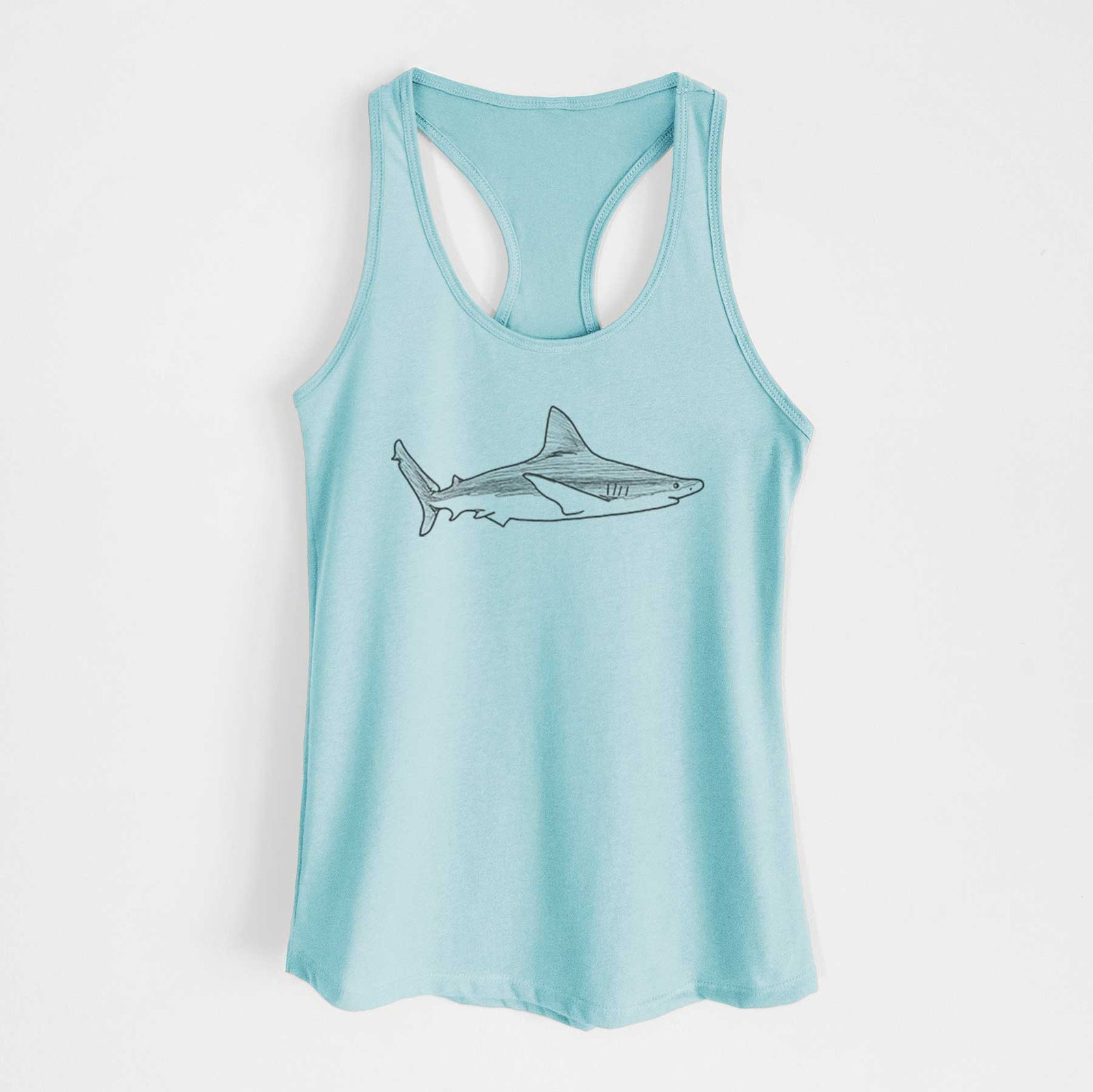 Banana cream women's racerback tank top laid flat, printed with a black ink illustration of a silvertip shark swimming in profile.