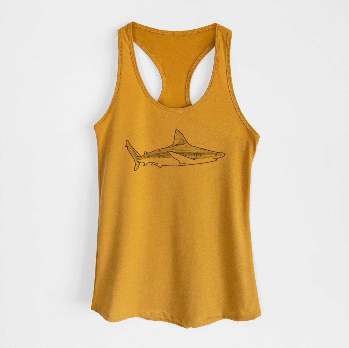 Gold women's racerback tank top laid flat, printed with a black ink illustration of a silvertip shark swimming in profile.