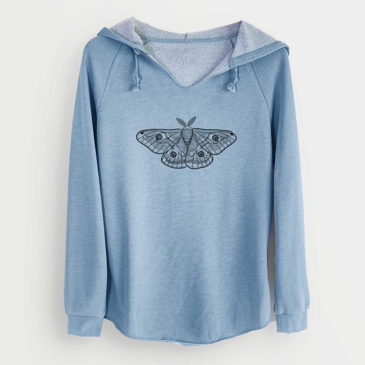 Misty blue women's Cali Wave hooded sweatshirt laid flat, printed with a detailed black ink illustration of a small emperor moth with eyespots on its wings.