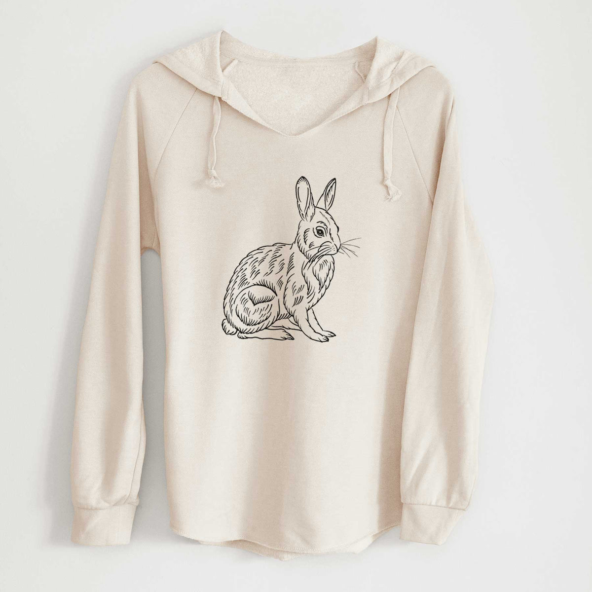 Bone cream women's Cali Wave hooded sweatshirt laid flat, printed with a detailed black ink illustration of a snowshoe hare sitting upright.
