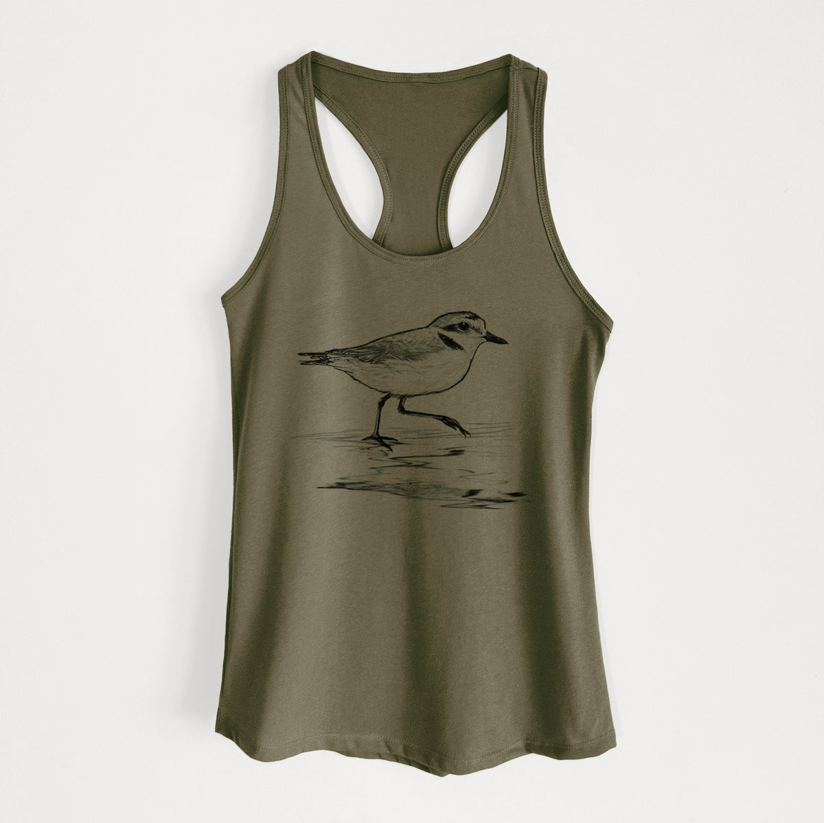 Military green women's racerback tank top laid flat, printed with a black ink sketch of a snowy plover running along the wet shoreline.