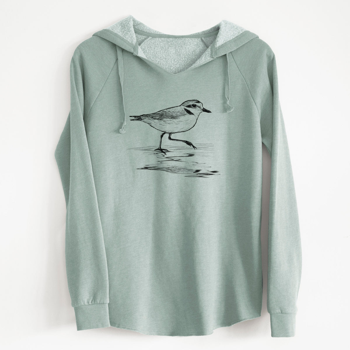Sage green women's Cali Wave hooded sweatshirt laid flat, printed with a black ink sketch of a snowy plover running along the wet shoreline.