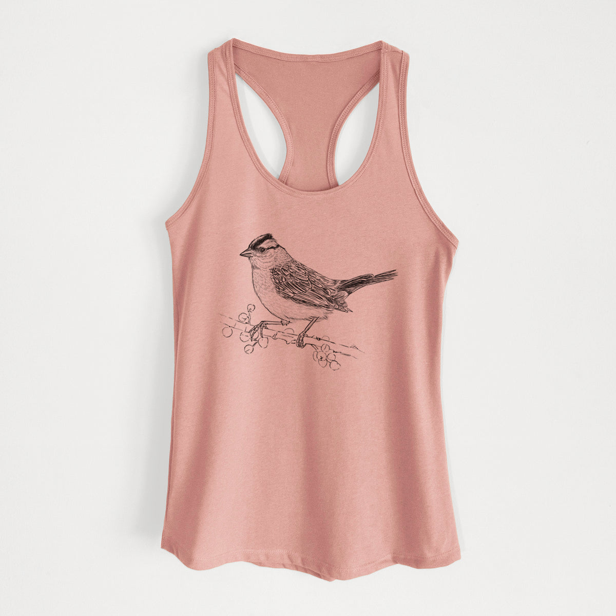 Desert pink women's racerback tank top laid flat, printed with a detailed black ink sketch of a white-crowned sparrow perched on a branch.