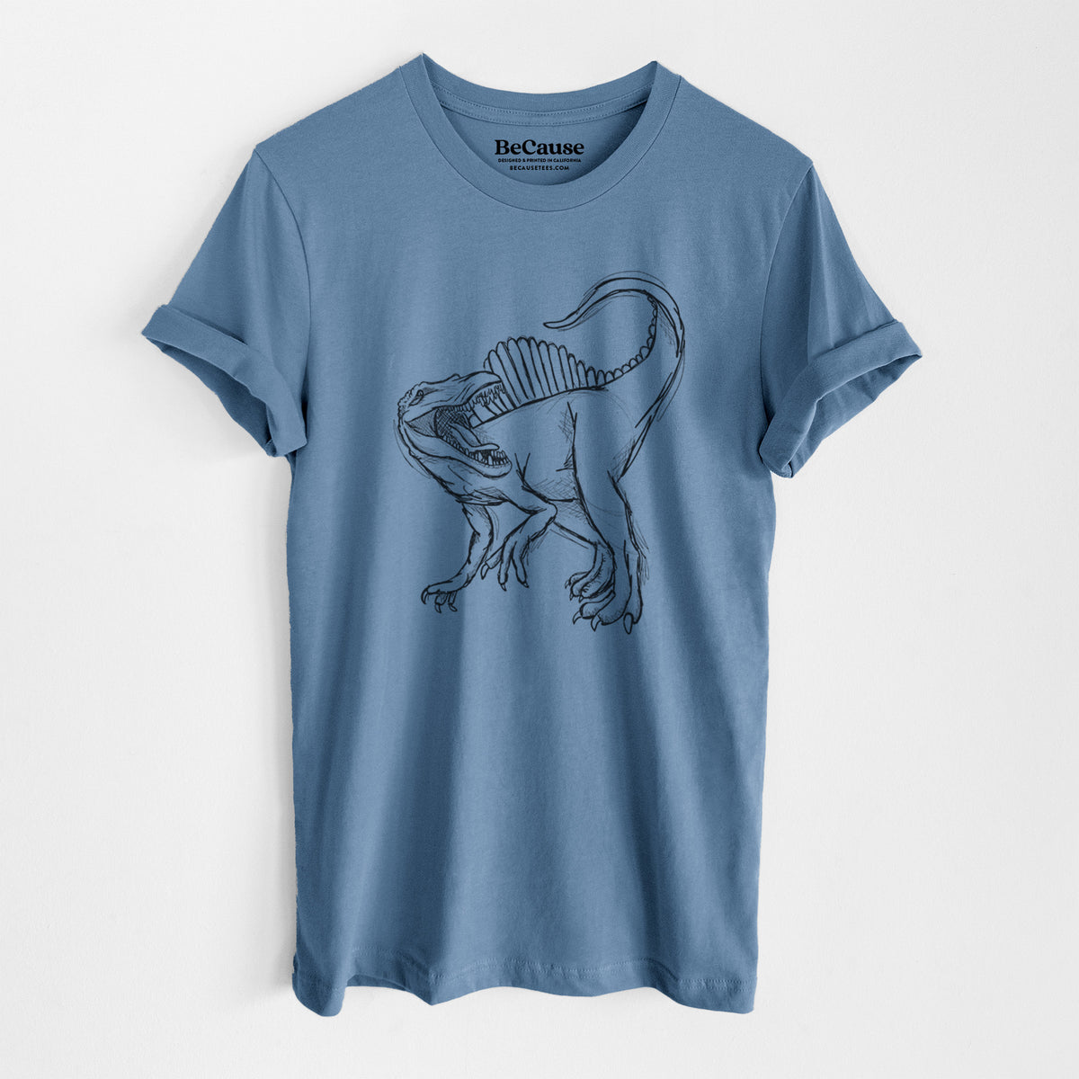 Steel blue lightweight cotton t-shirt laid flat, printed with a black ink illustration of a Spinosaurus with its tall sail-shaped back.