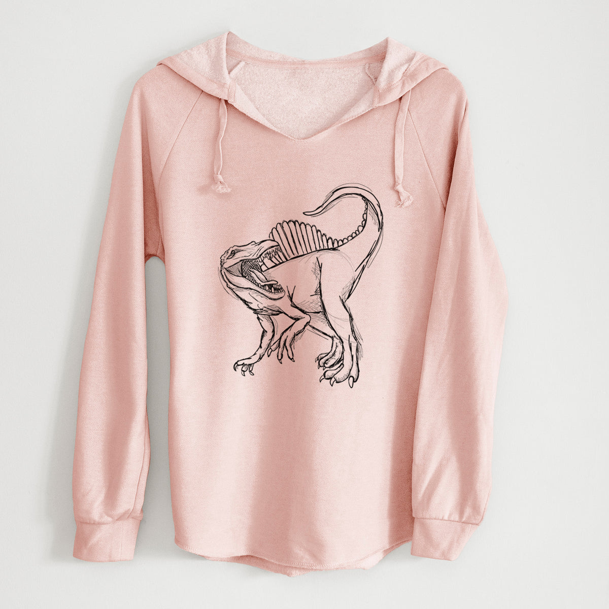 Blush pink women's Cali Wave hooded sweatshirt laid flat, printed with a black ink illustration of a Spinosaurus with its tall sail-shaped back.
