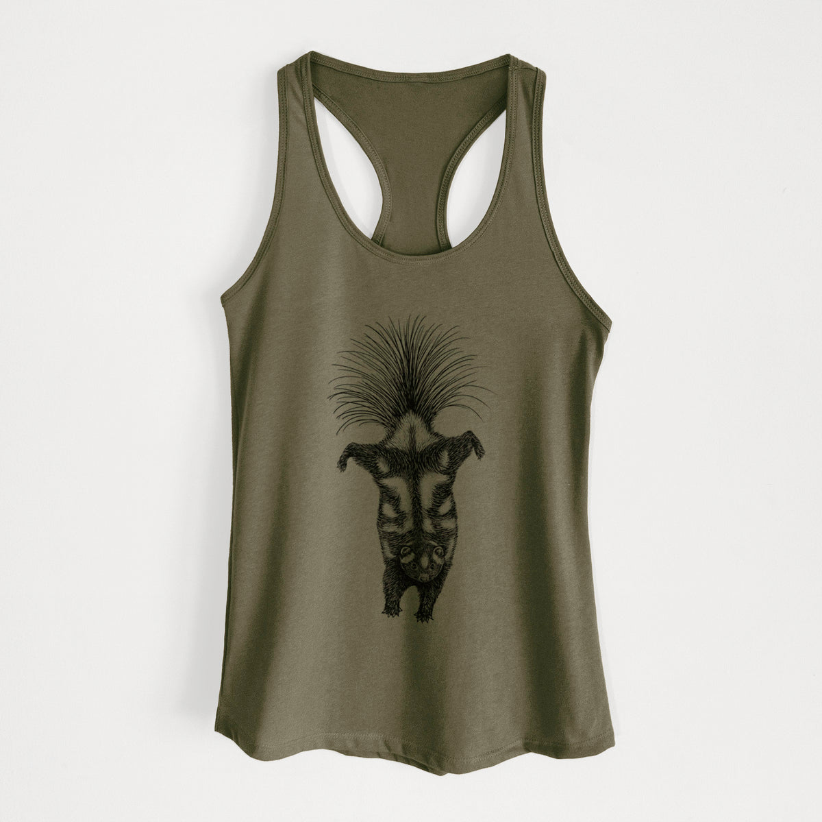 Military green women's racerback tank top laid flat, printed with a black ink illustration of a spotted skunk doing a handstand with its tail fanned.