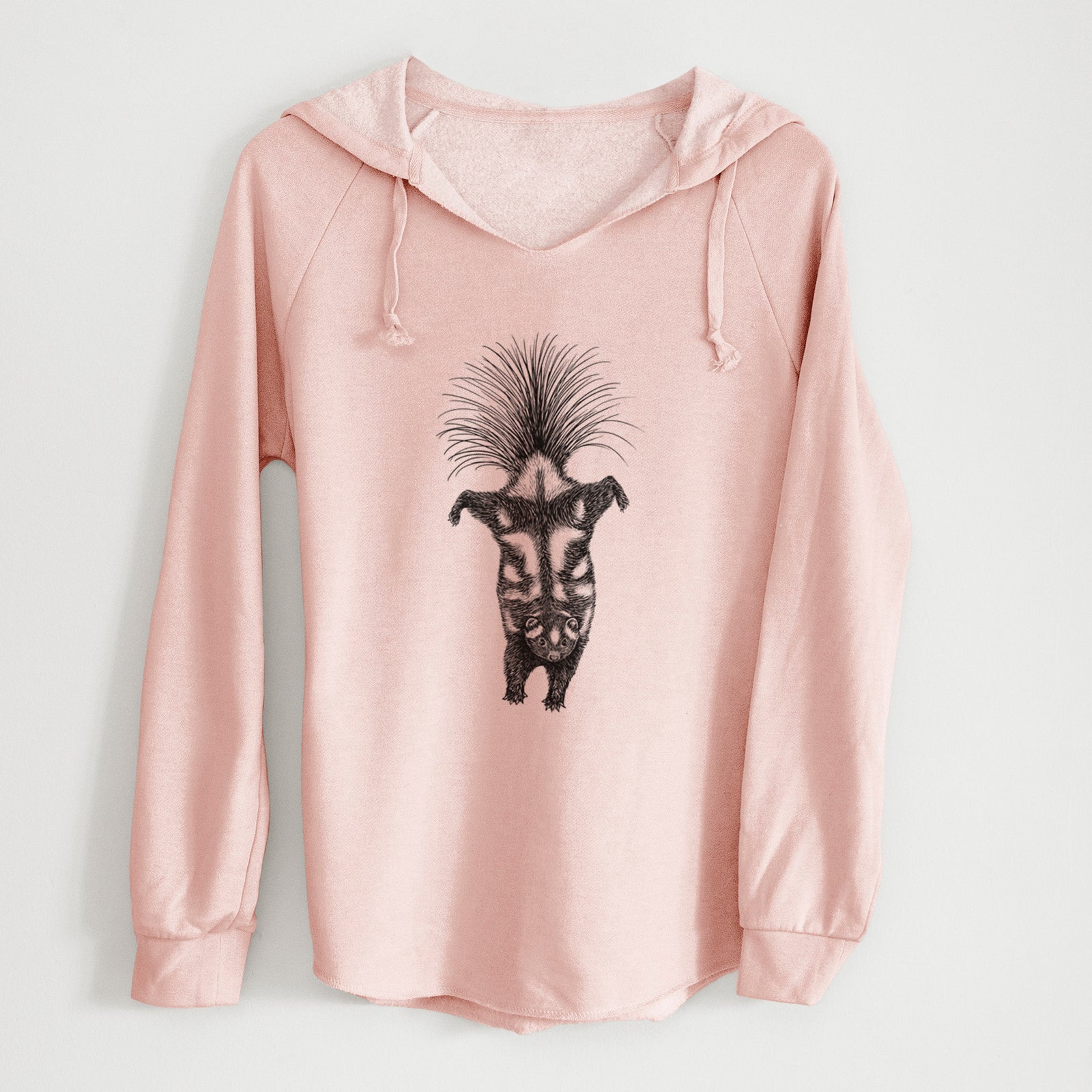 Sage green women's Cali Wave hooded sweatshirt laid flat, printed with a black ink illustration of a spotted skunk doing a handstand with its tail fanned.
