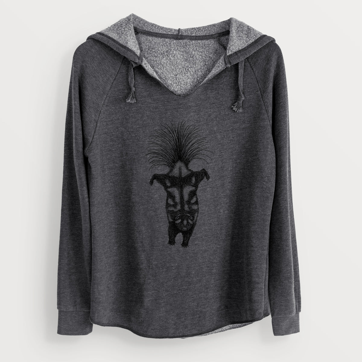 Charcoal grey women's Cali Wave hooded sweatshirt laid flat, printed with a black ink illustration of a spotted skunk doing a handstand with its tail fanned.
