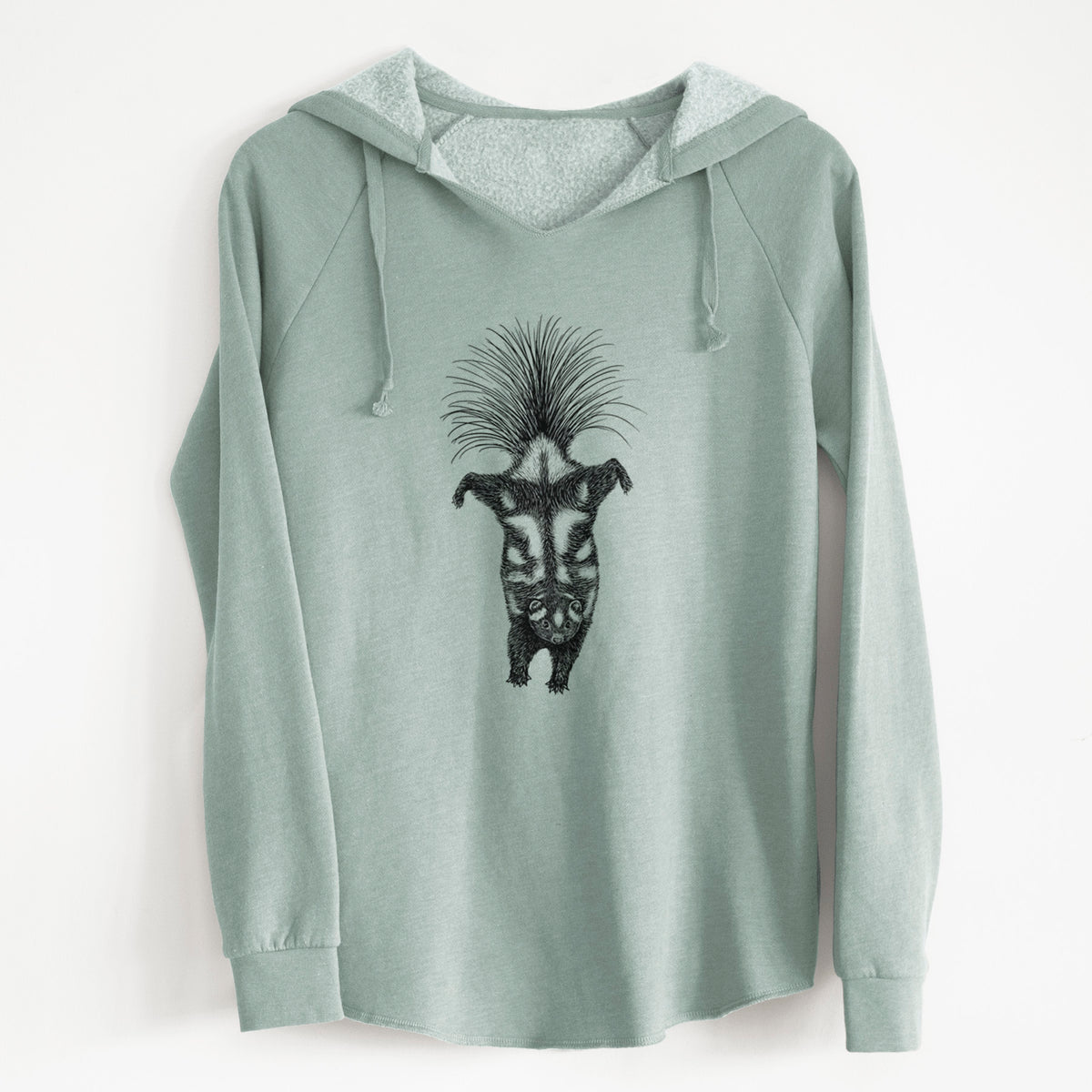Sage green women's Cali Wave hooded sweatshirt laid flat, printed with a black ink illustration of a spotted skunk doing a handstand with its tail fanned.