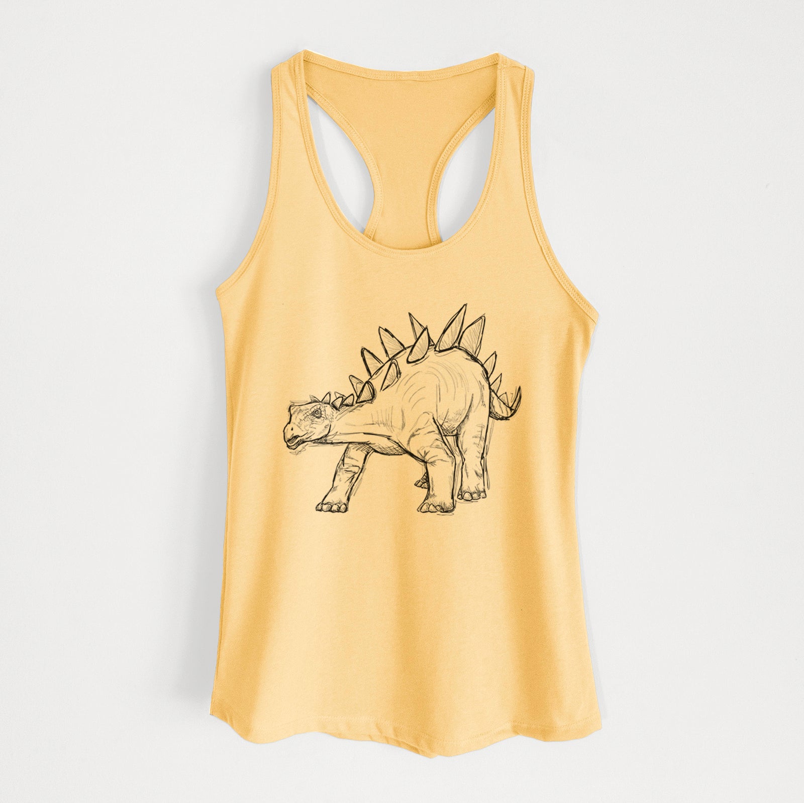 Banana cream women's racerback tank top laid flat, printed with a black ink illustration of a Stegosaurus with plates along its back.